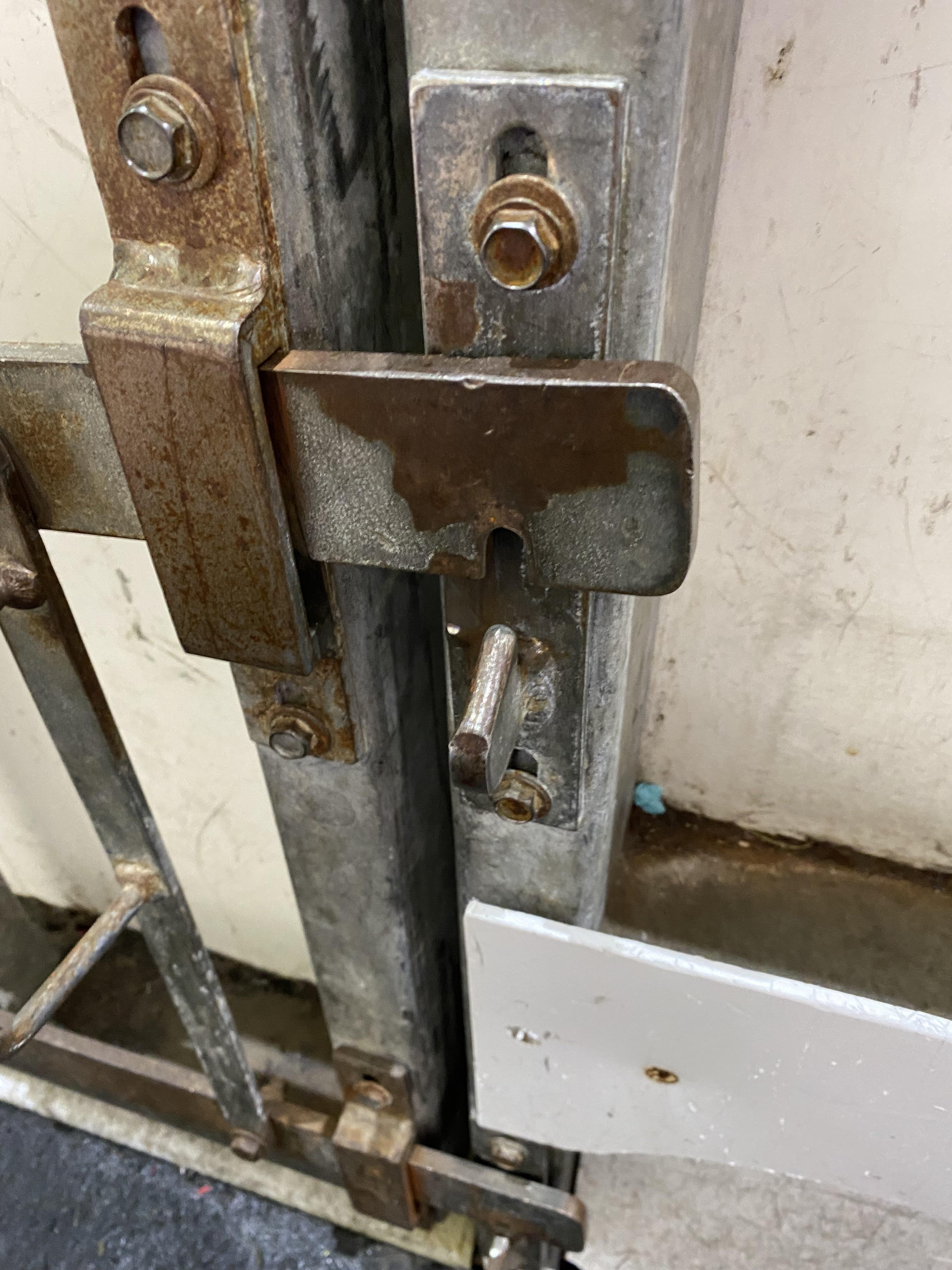 Hockey rink door latch from the late 1970s has seen some mileage r