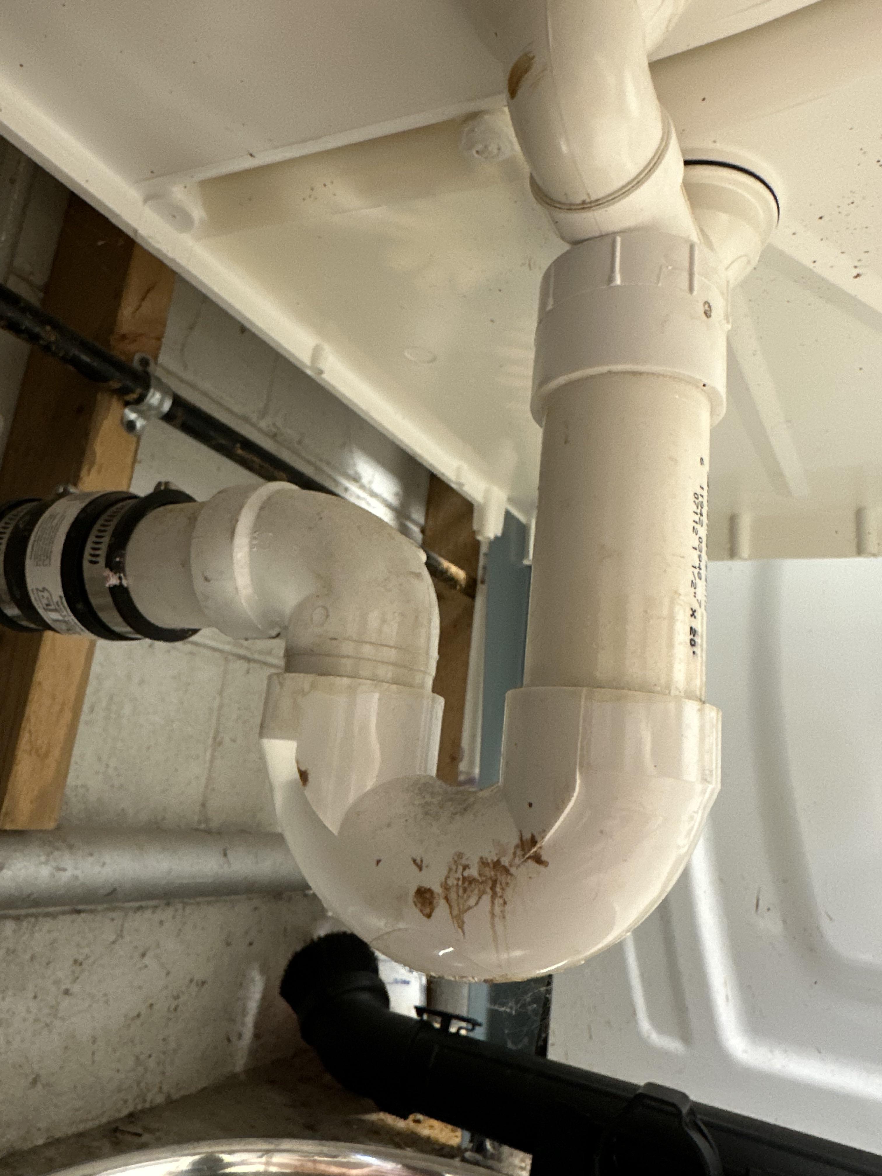 Garbage disposal contents are backing up into my basement sink, trying