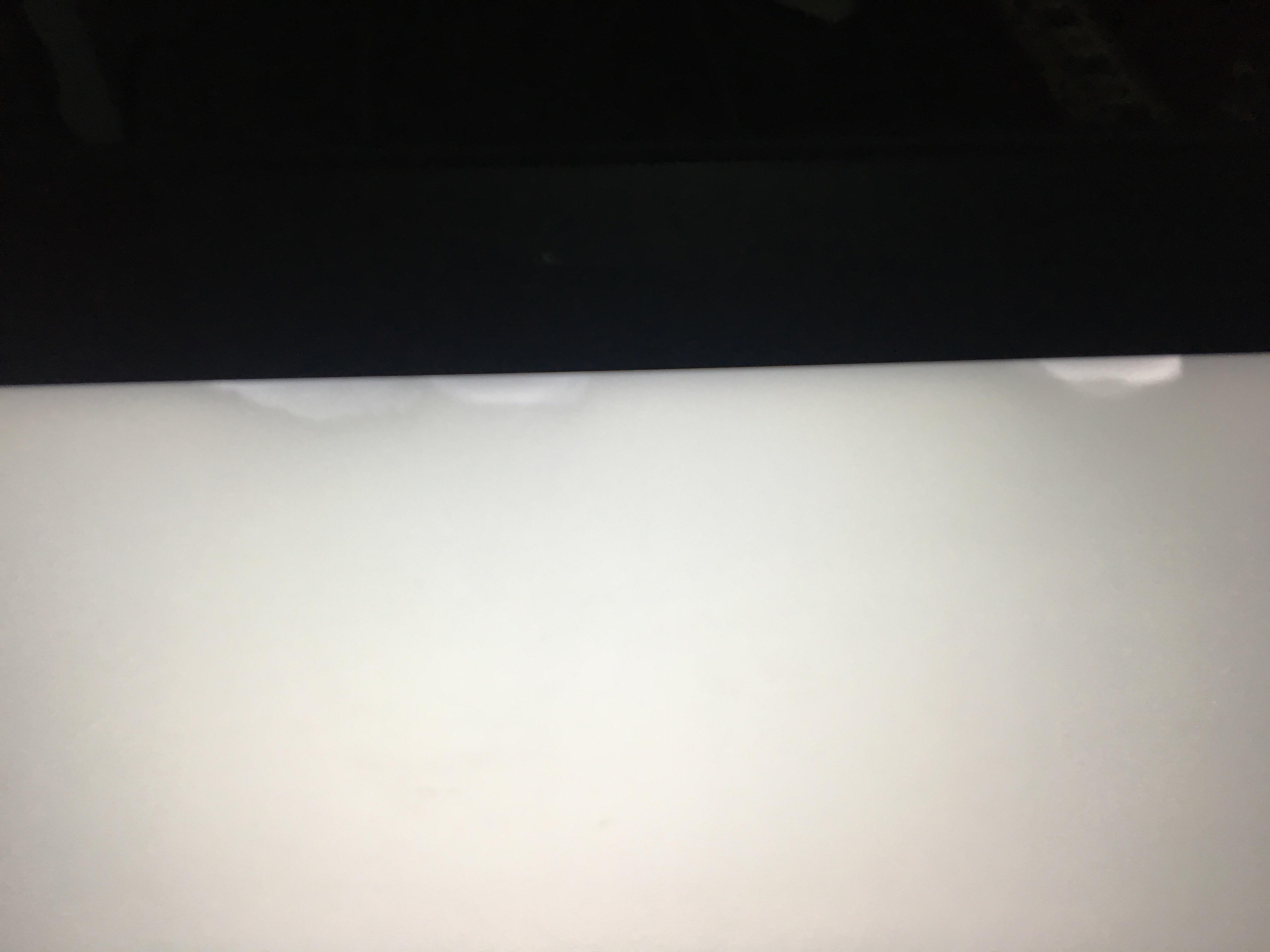 Anyone knows what causes these white spots on the top edge of my laptop