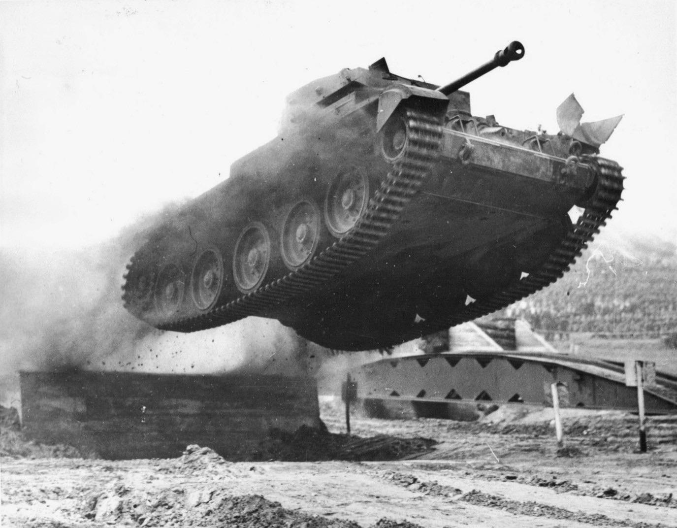 A Cromwell tank flying off a ramp during trials. r/TankPorn