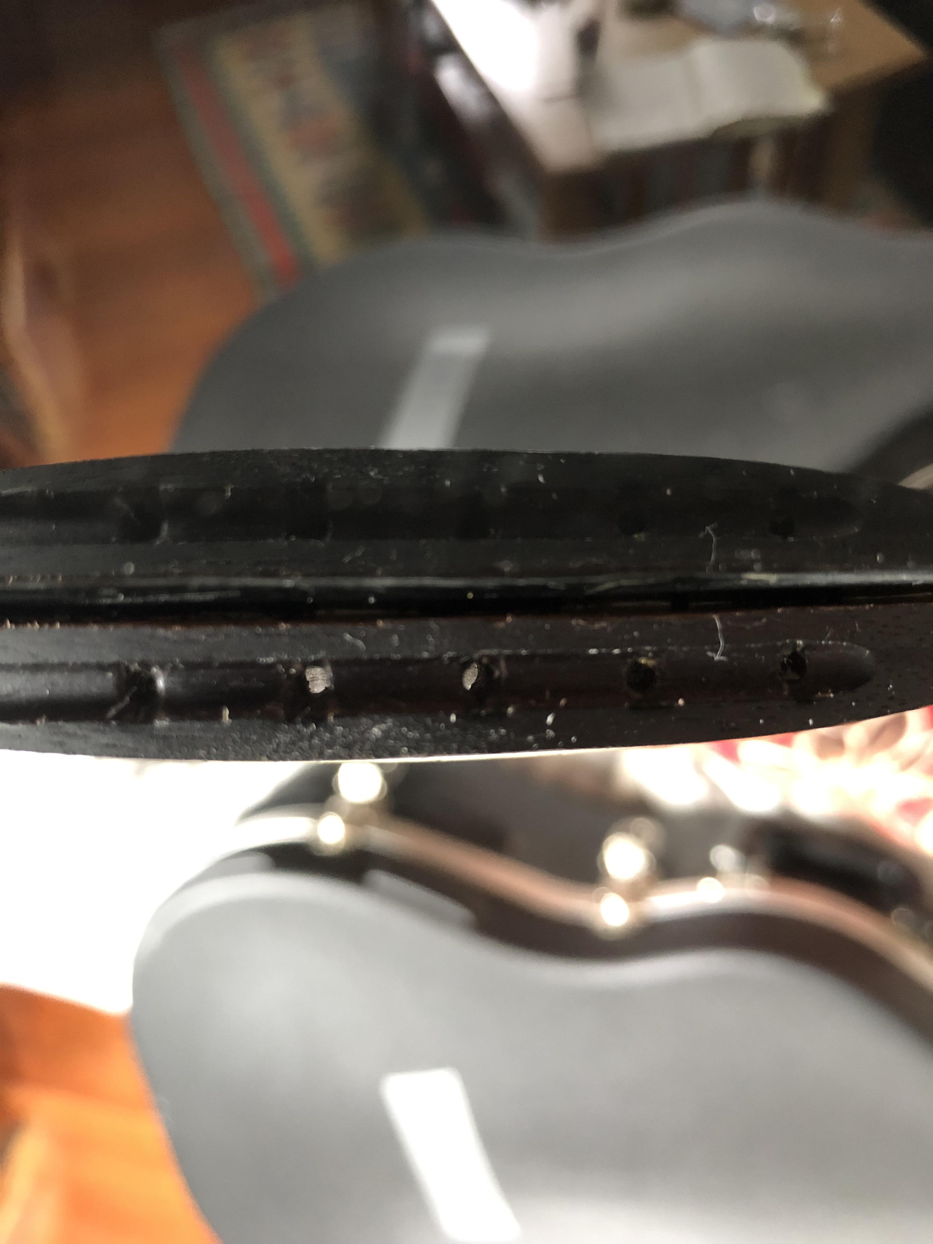 How would I fix the bridge peeling off of an Ovation Applause AE 128