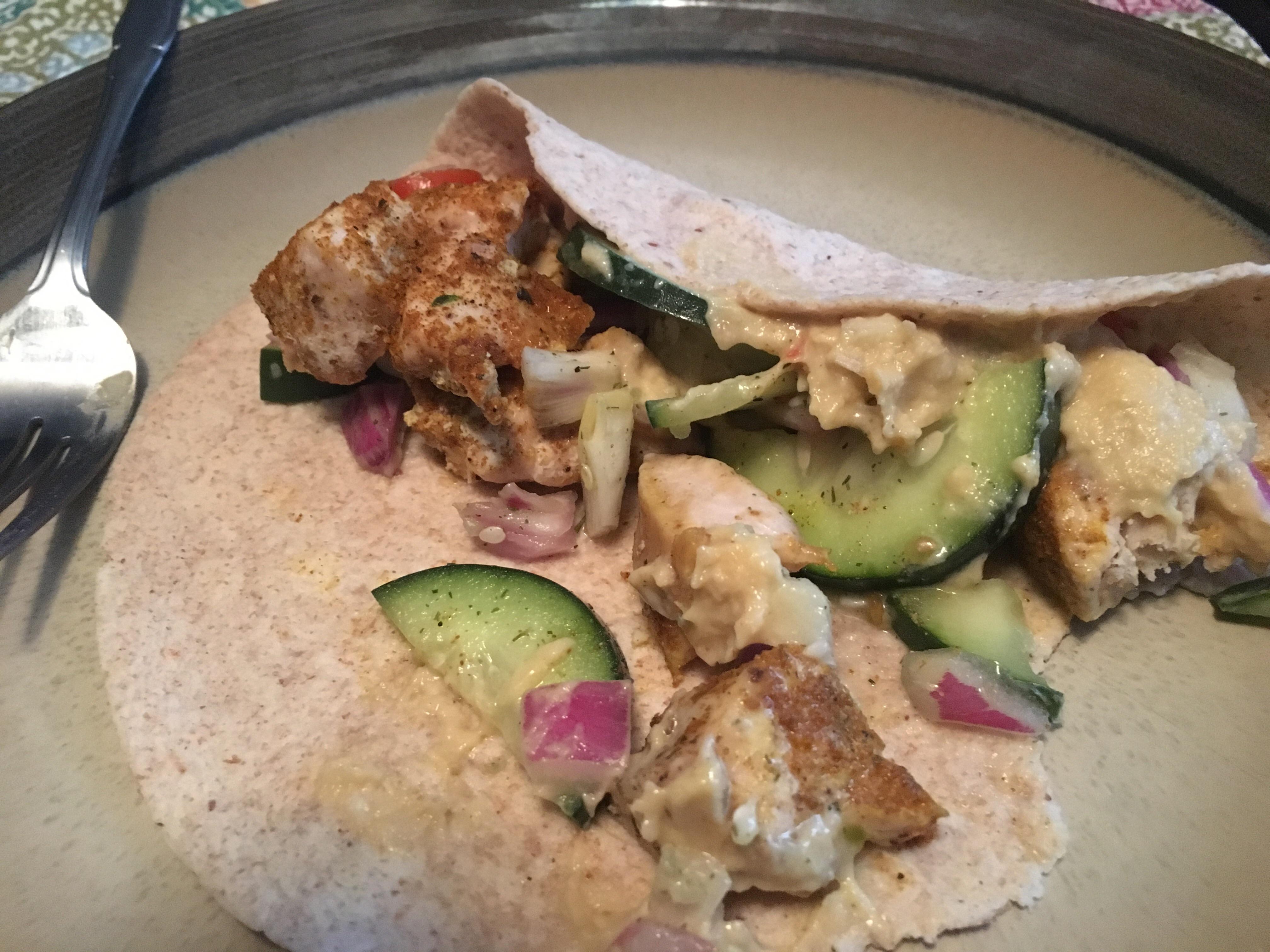 Tikka masala seasoned chicken, hummus and cucumber salad wrap for 350