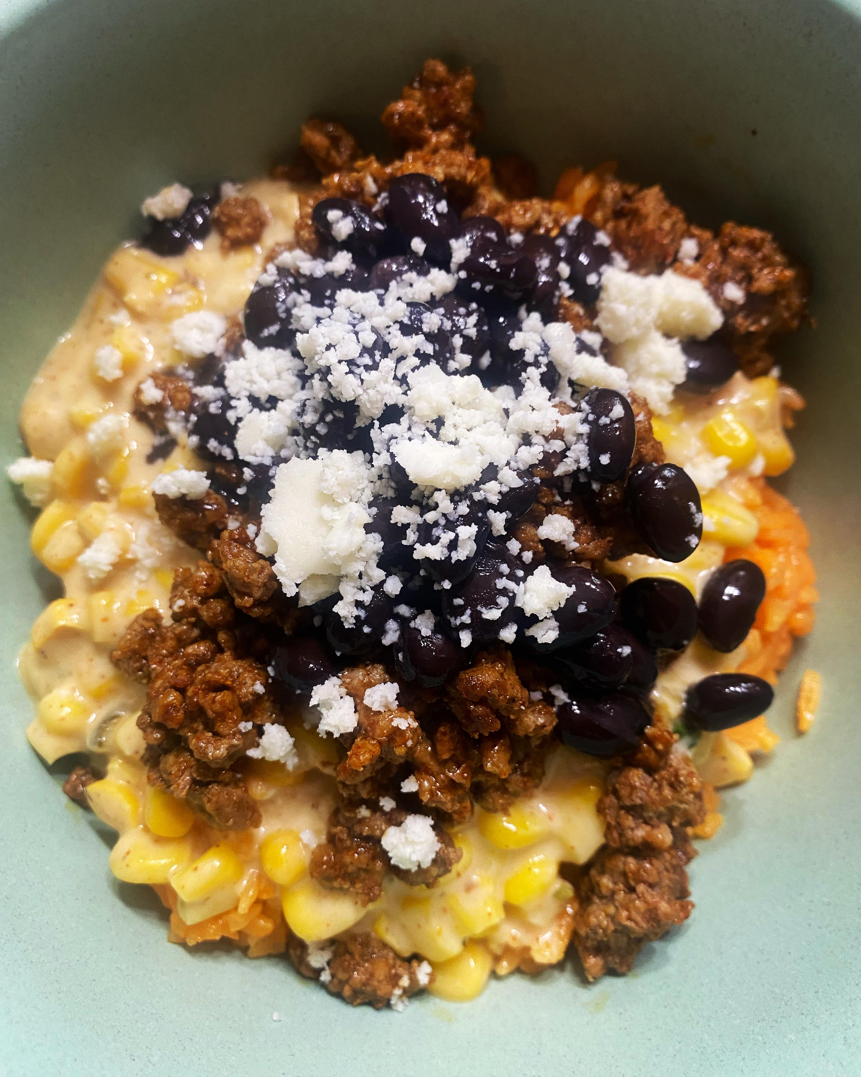 Sazon rice, Mexican cheesy corn, taco ground beef, black beans, and