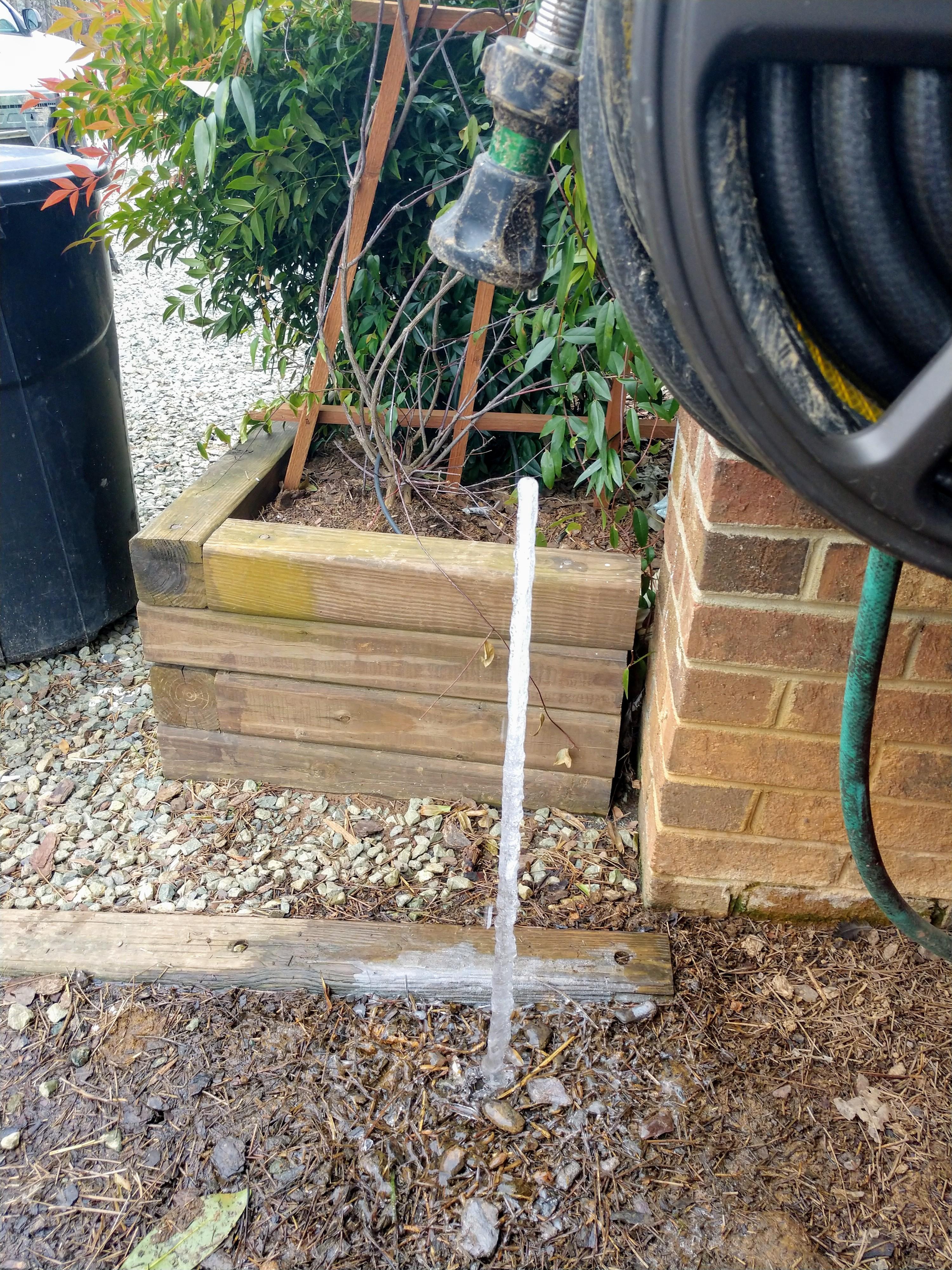 This icicle that formed under my dripping water hose. r/mildlyinteresting