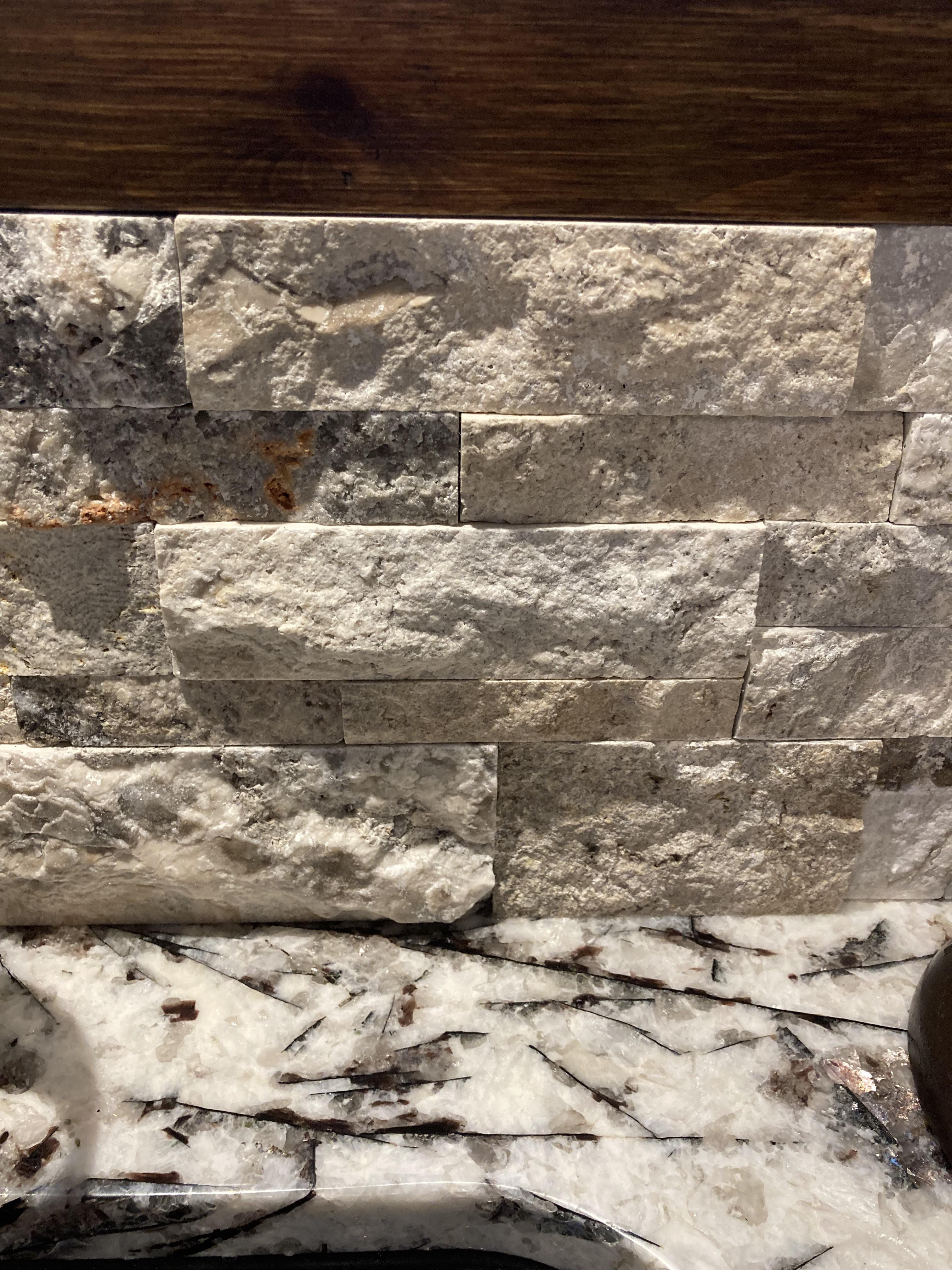 Do I need to put silicone between the granite and the ledge stone if it