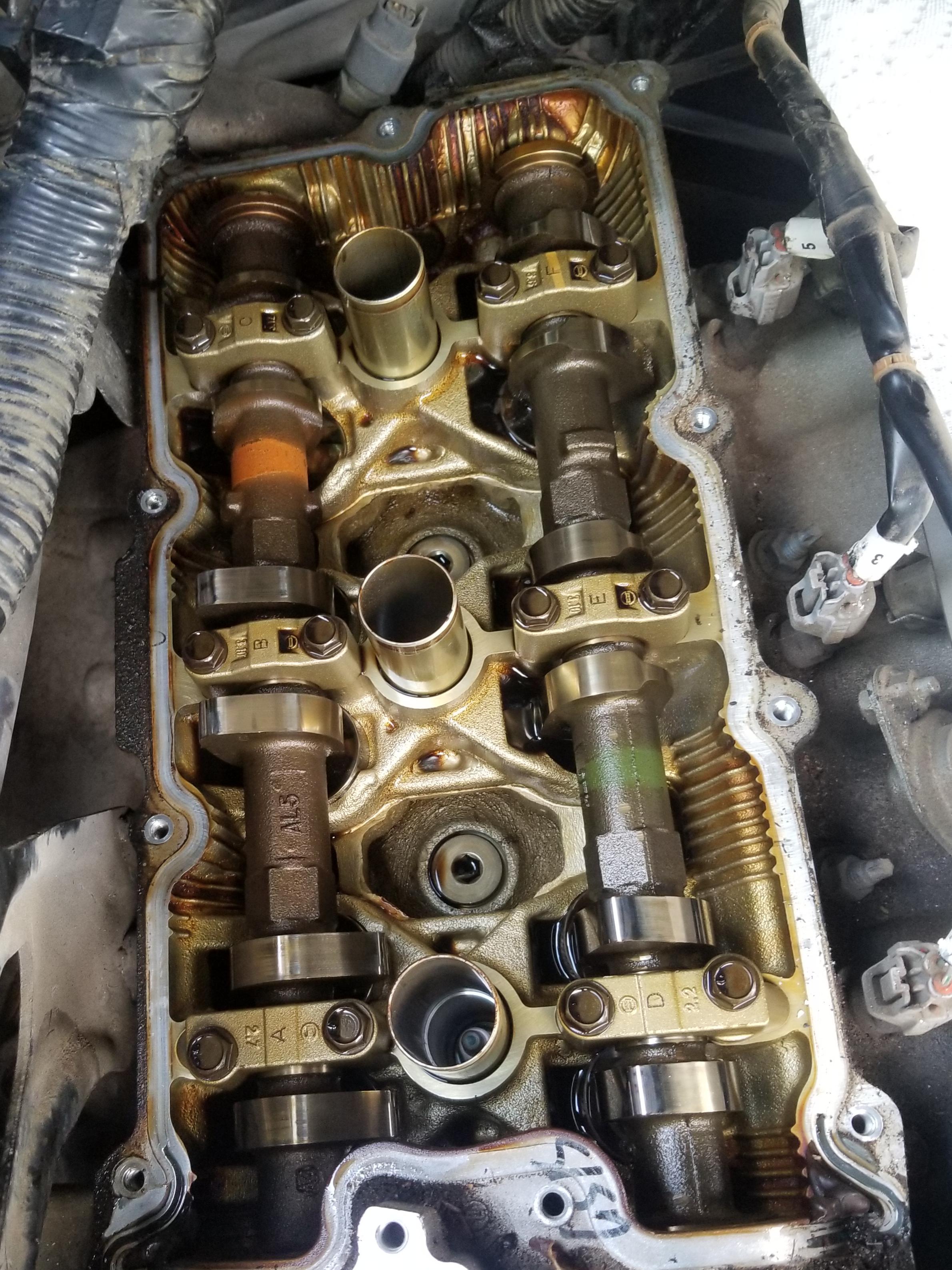 Replacing valve cover gasket. Anyone know what's causing that rusty