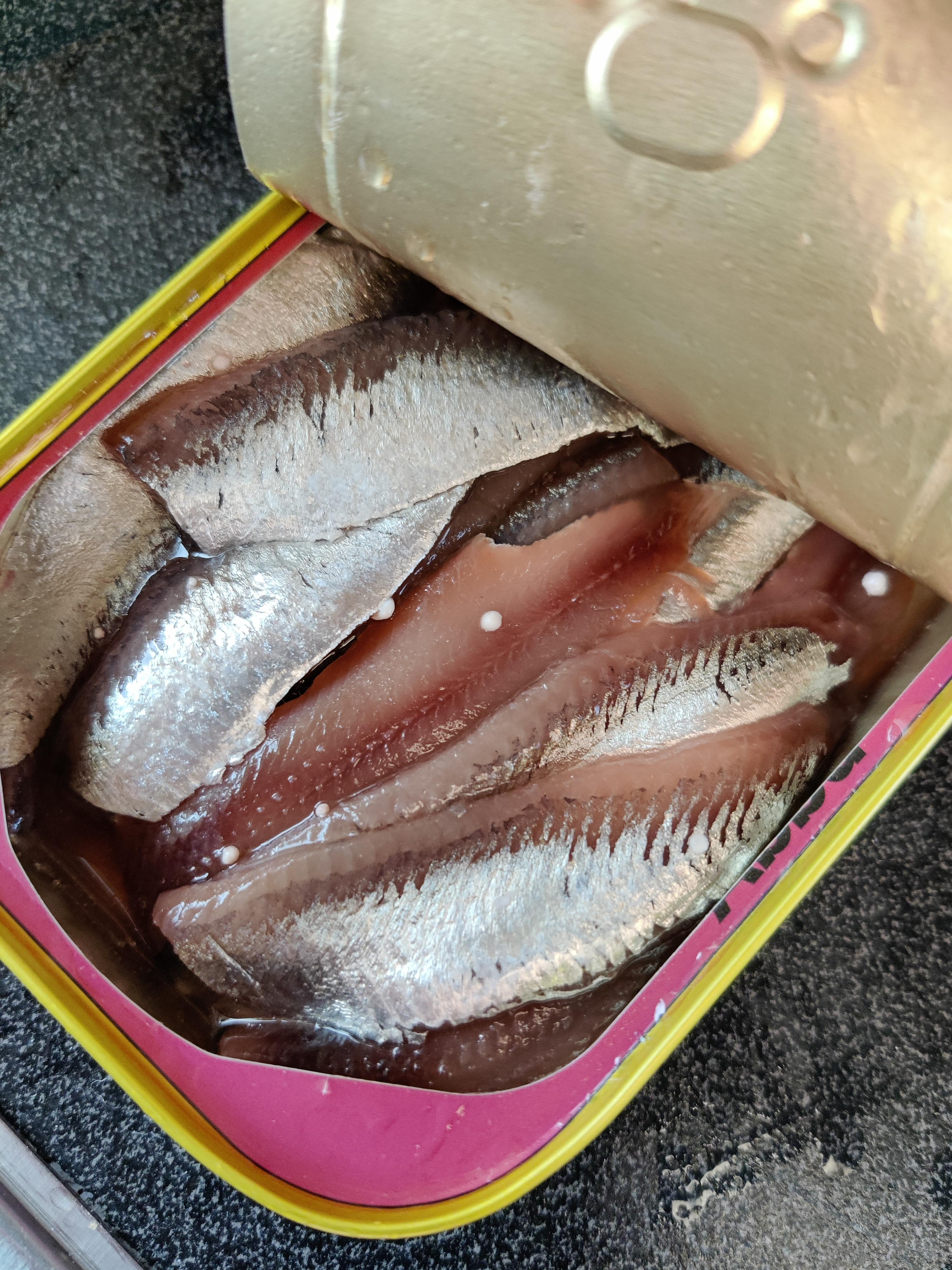 I opened a can of "ansjovis" (Swedish, canned allspice flavoured