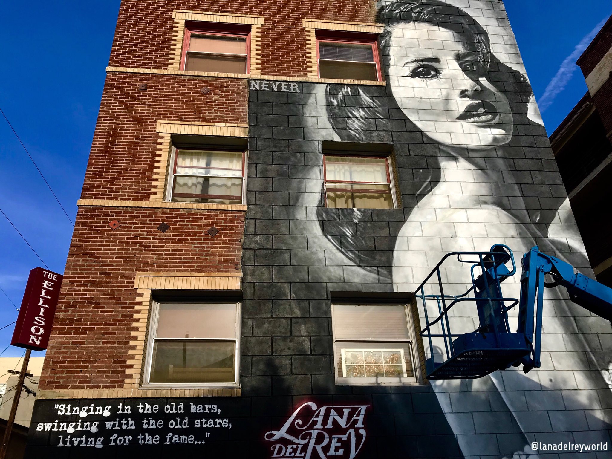 A mural of Lana Del Rey is featured on the wall of the historic Ellison