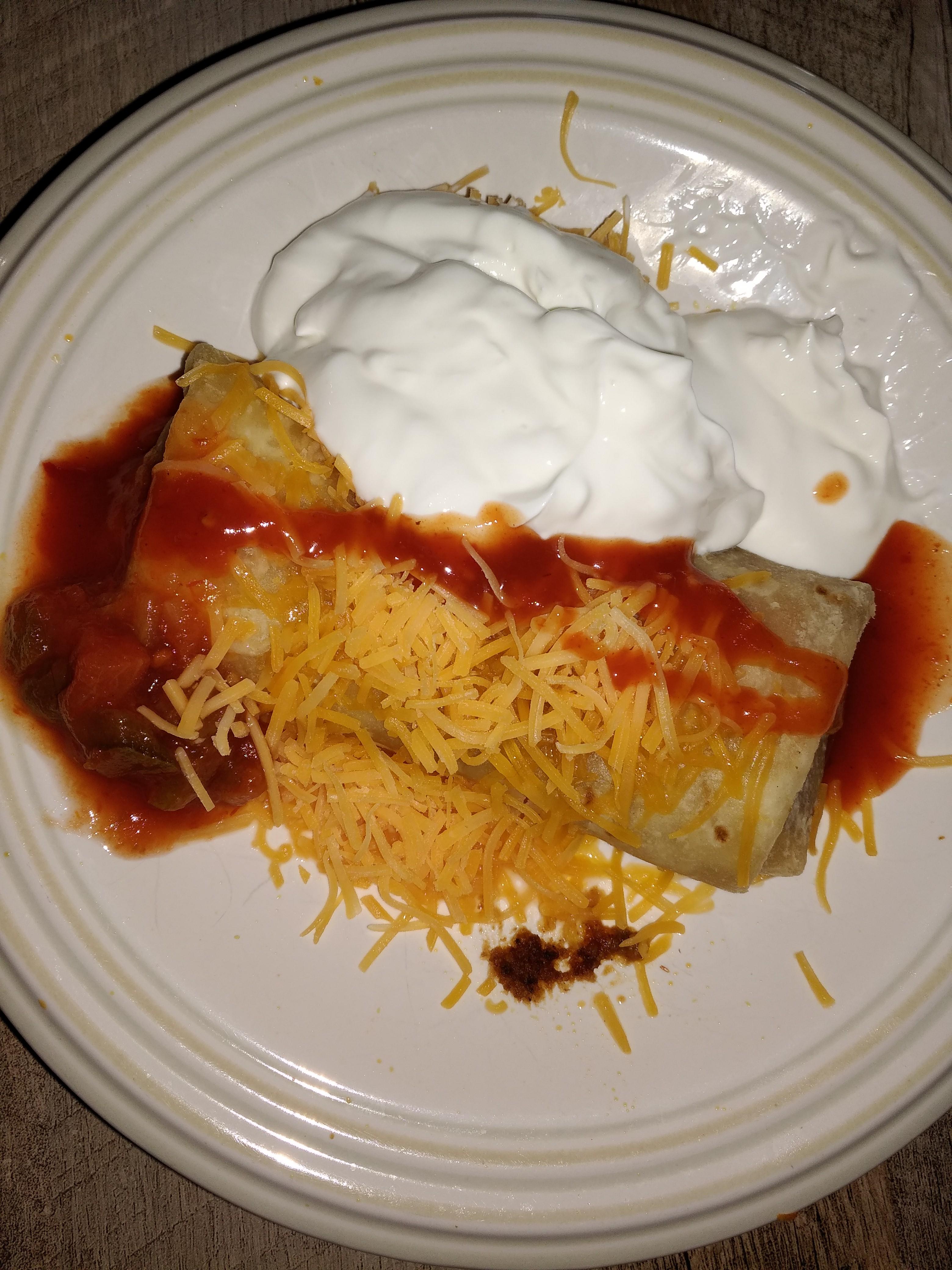El Monterey chimichanga with cheddar cheese, taco sauce, salsa, and