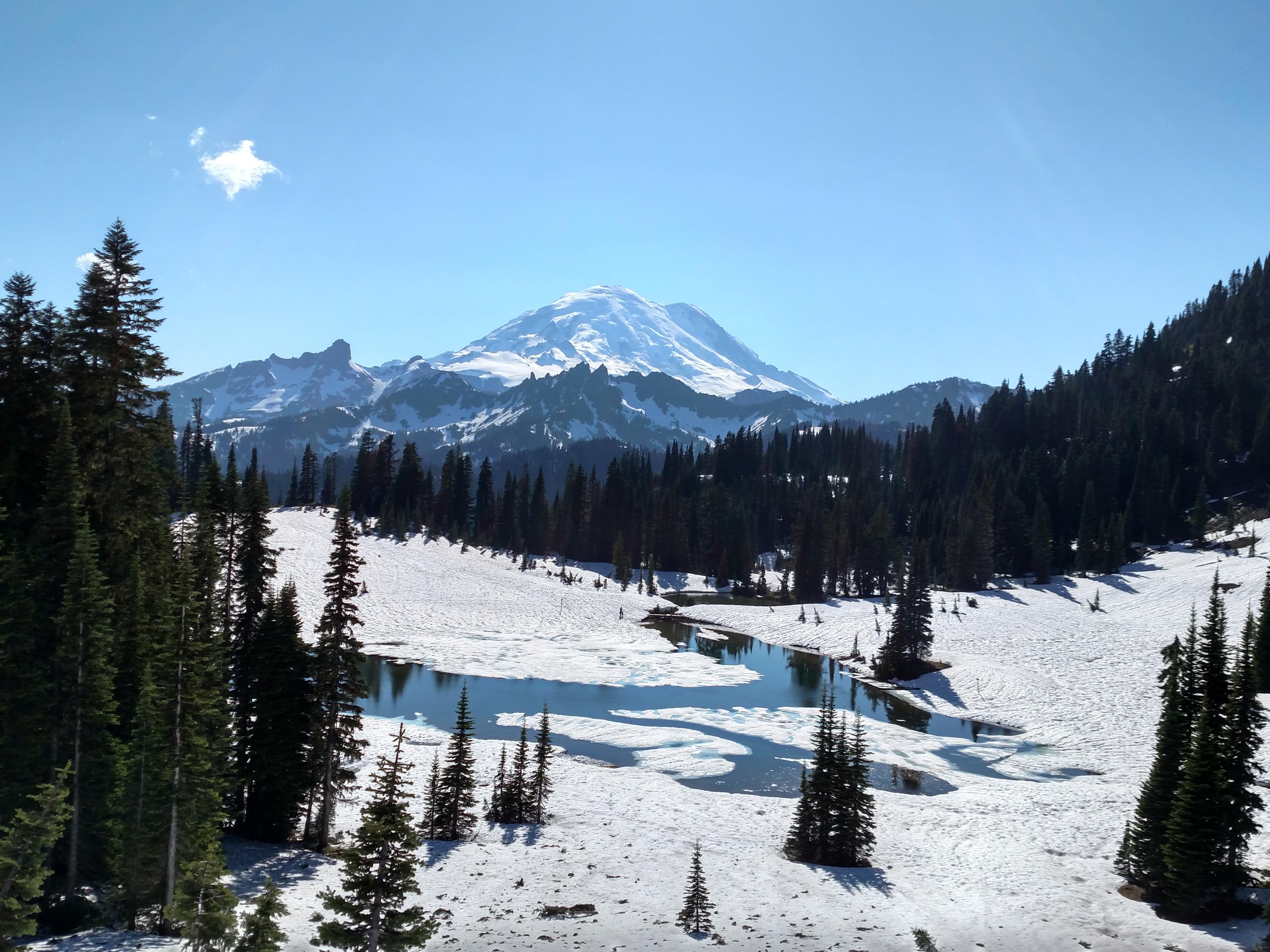 A frozen a Tipsoo lake with Mt. Rainier overlooking [OC] [5900x3200