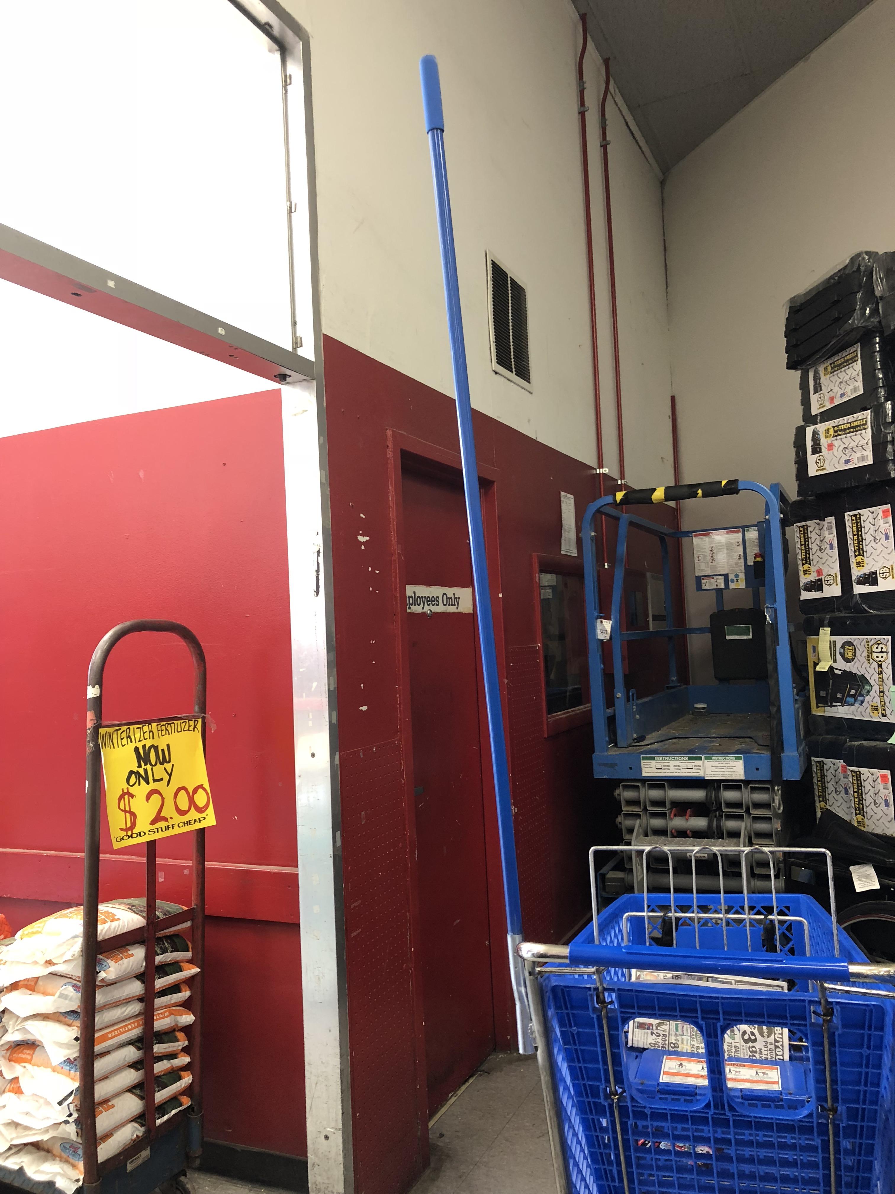 A discount store near me attaches poles to their shopping carts to keep