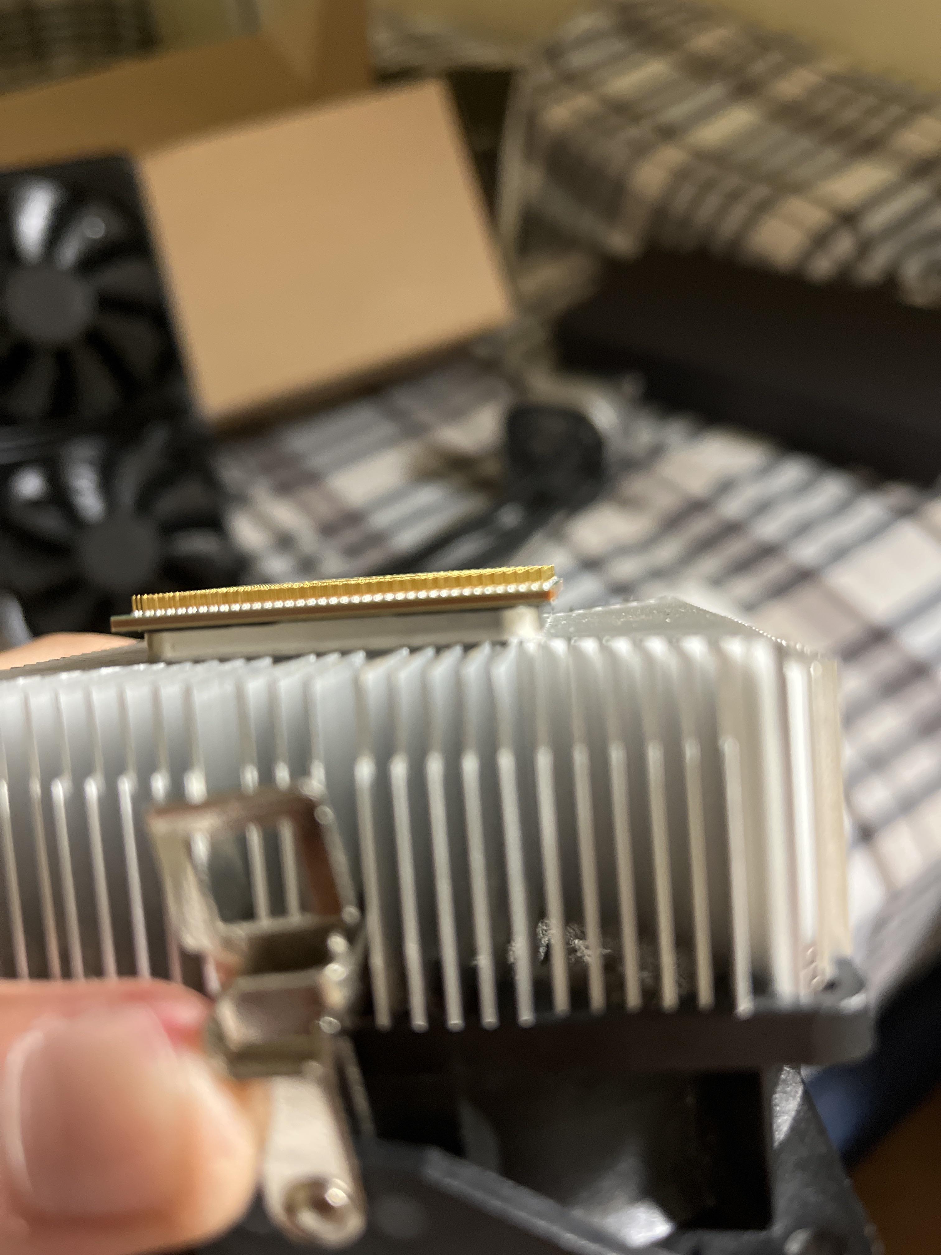 CPU is stuck to heatsink. There isn’t even a gap between the cpu and