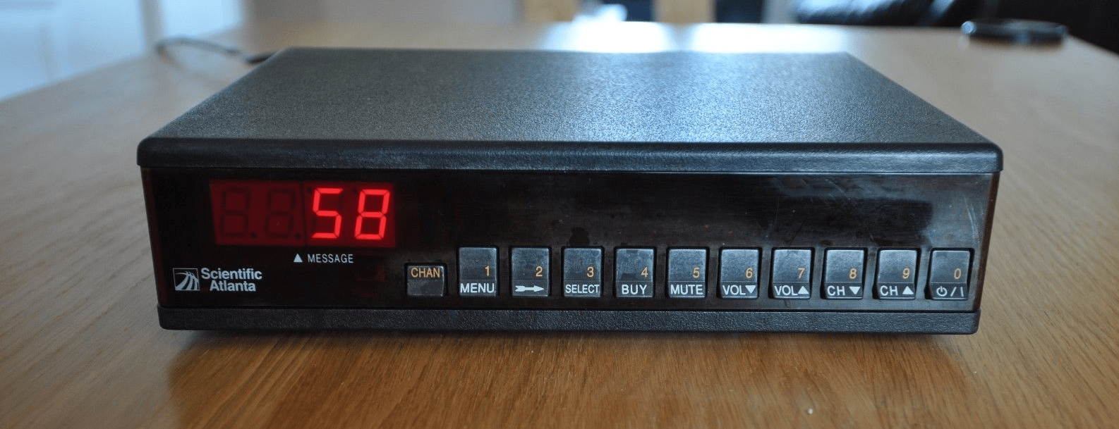 A vintage Scientific Atlanta cable box with numeric buttons on the front r/CableTV_Memories