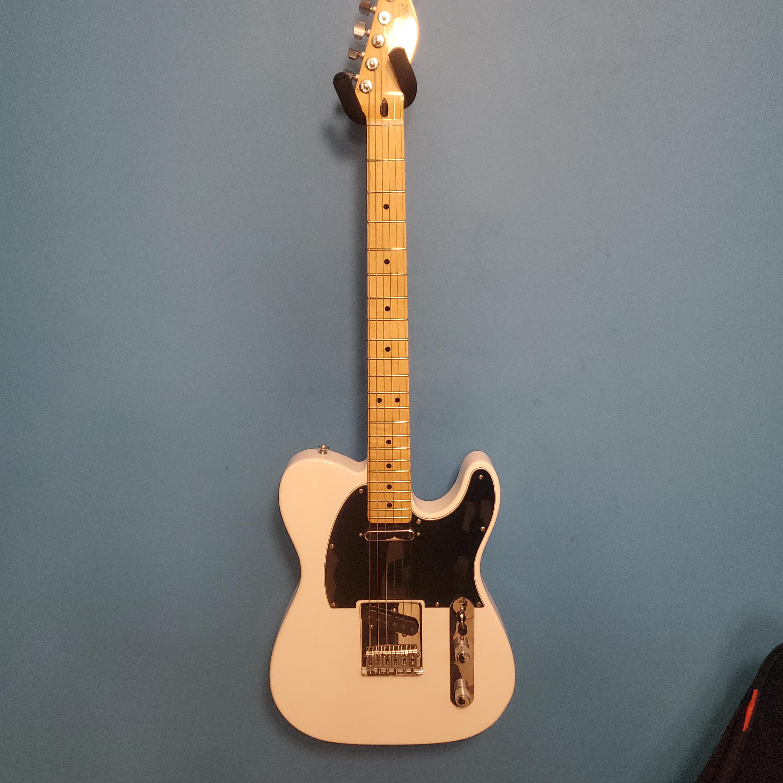 My modified Player Series Tele. Put in a black pickguard, locking