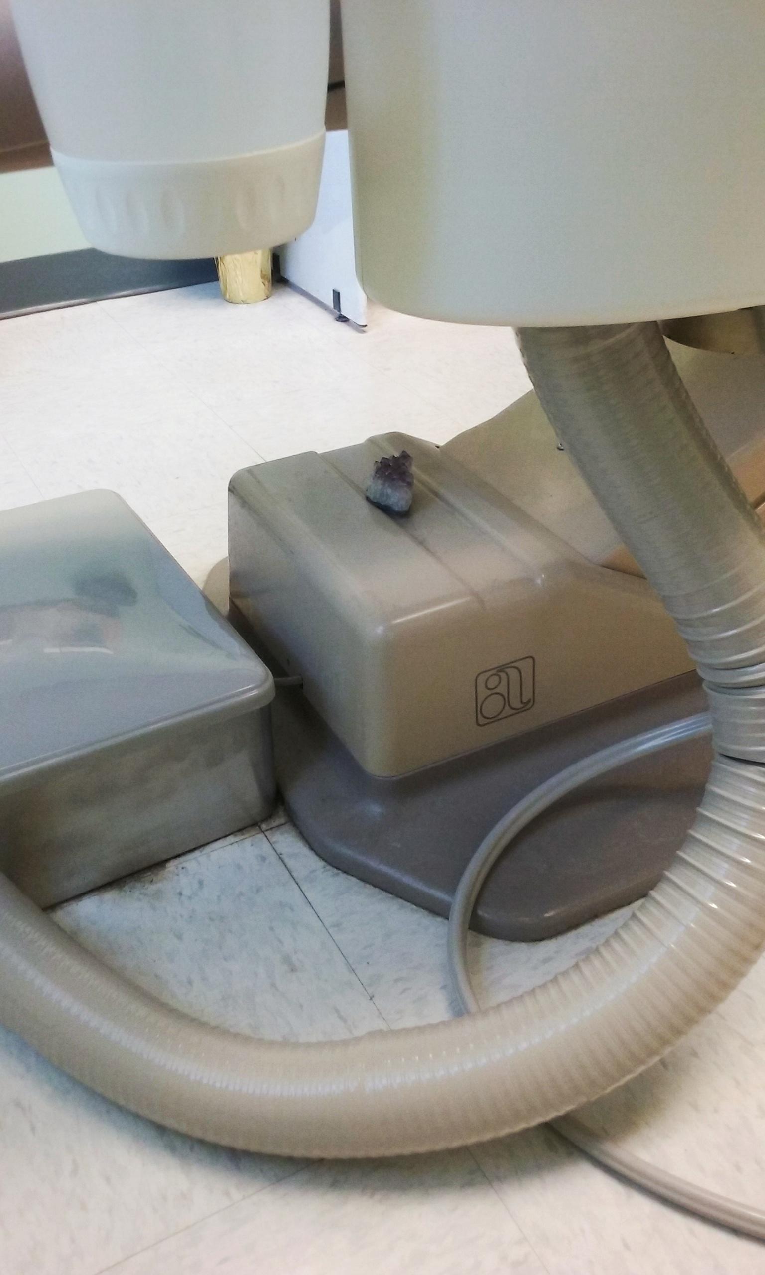 this amethyst crystal just chillin' under a chair at the dentist's r