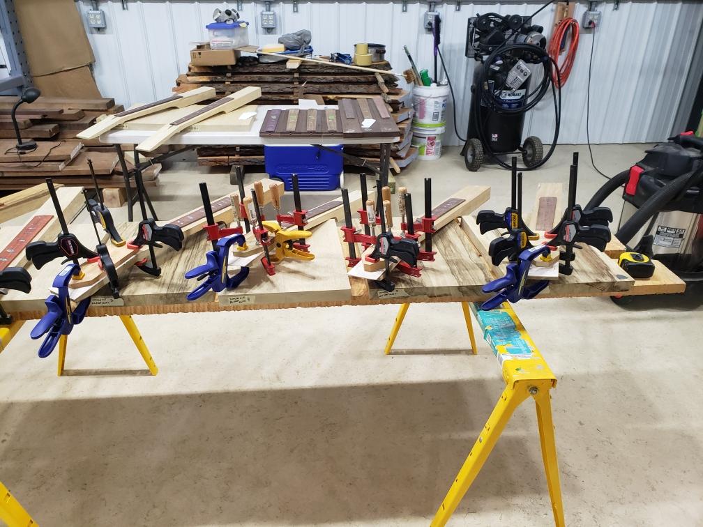 Gluing fretboards and headstock veneers tonite. r/guitarporn