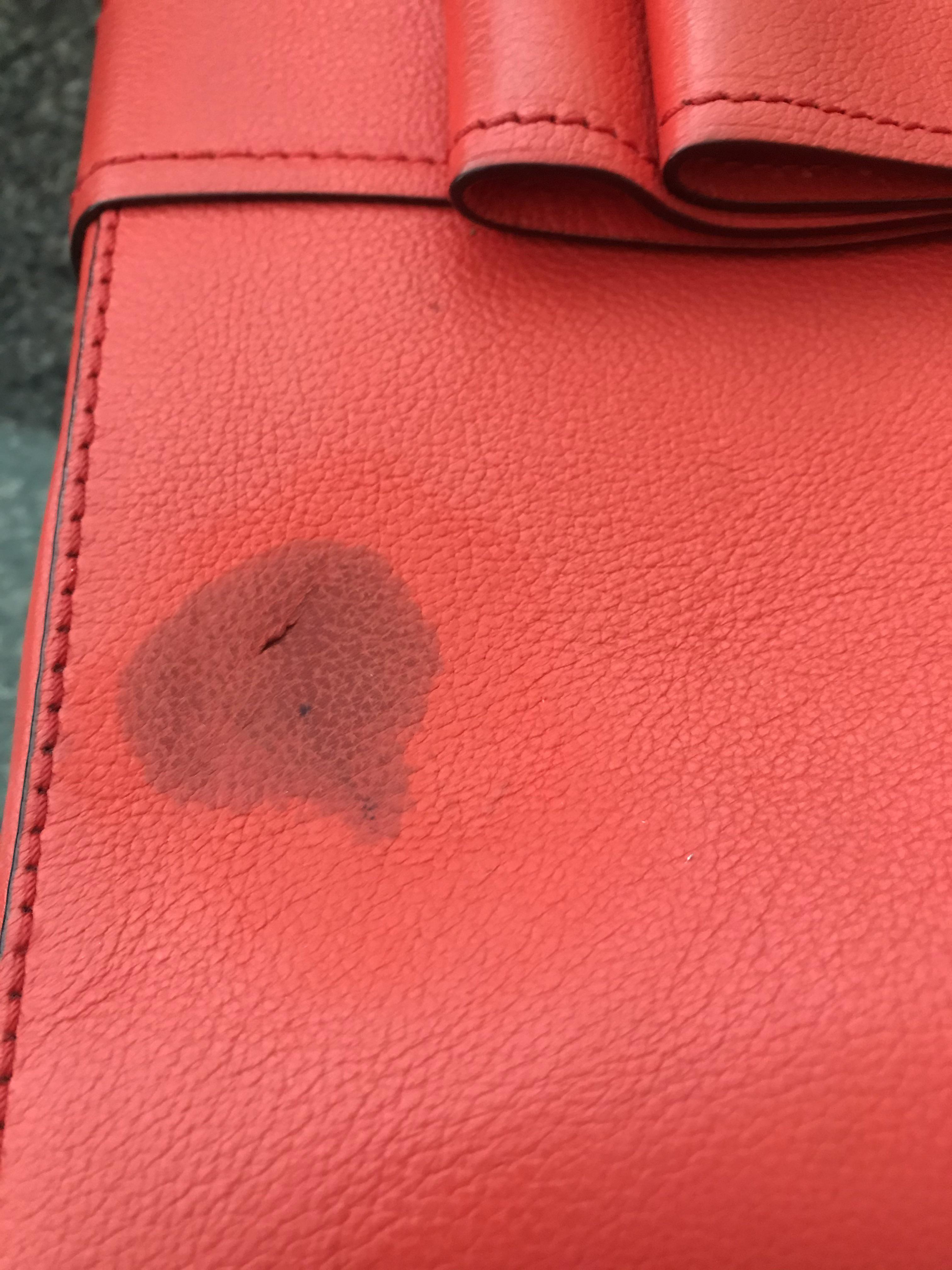 Used magic eraser to try to remove pen mark from purse, made it worse