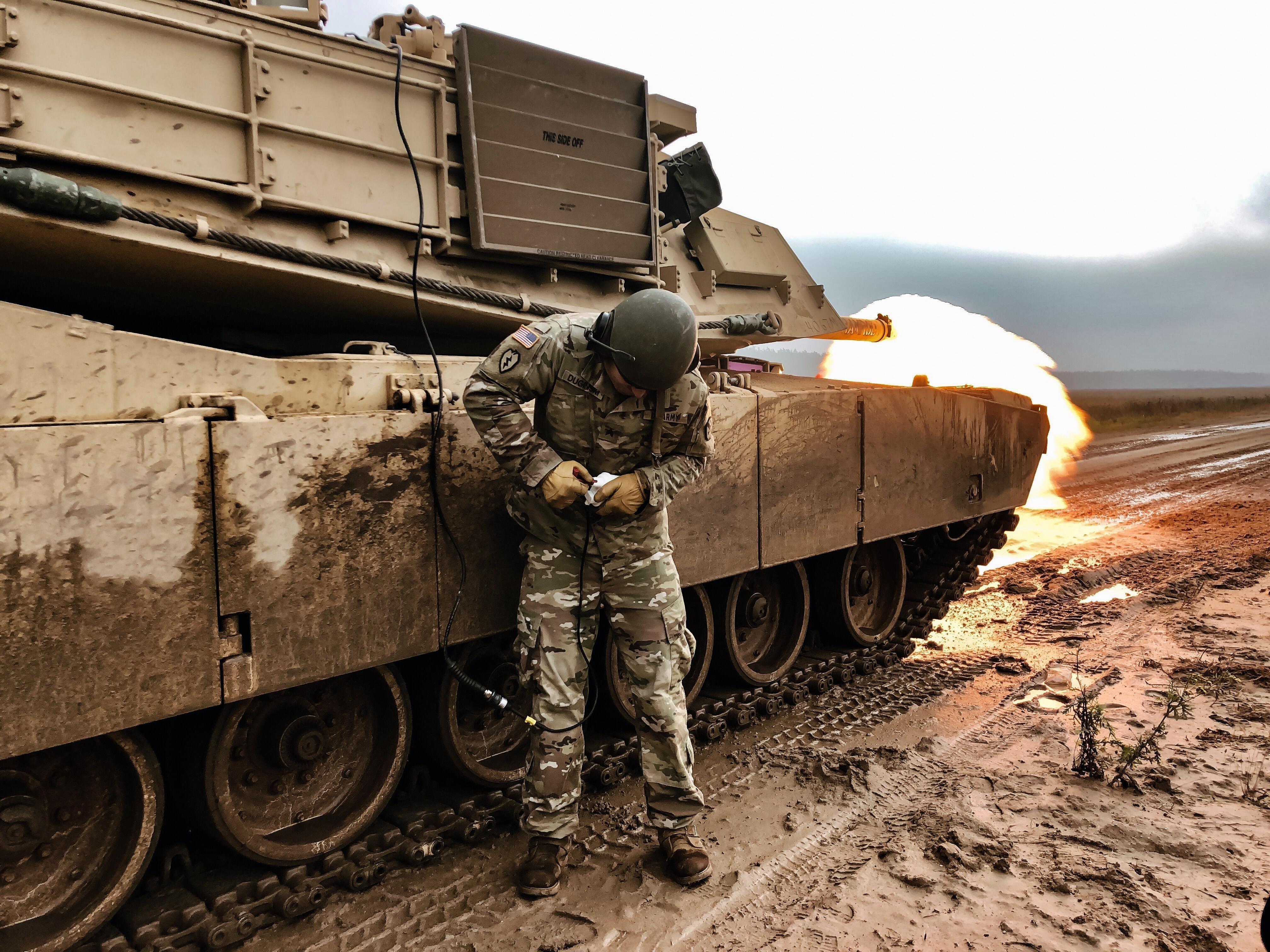 U.S. Army Sgt. Ryan Duginski, Abrams Tank Master Gunner, performs a