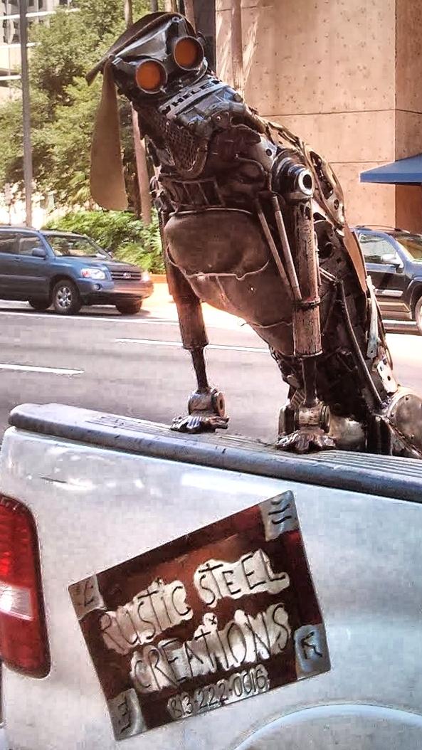 That's So Metal metalsmith dog sculpture in the bed of a pick up