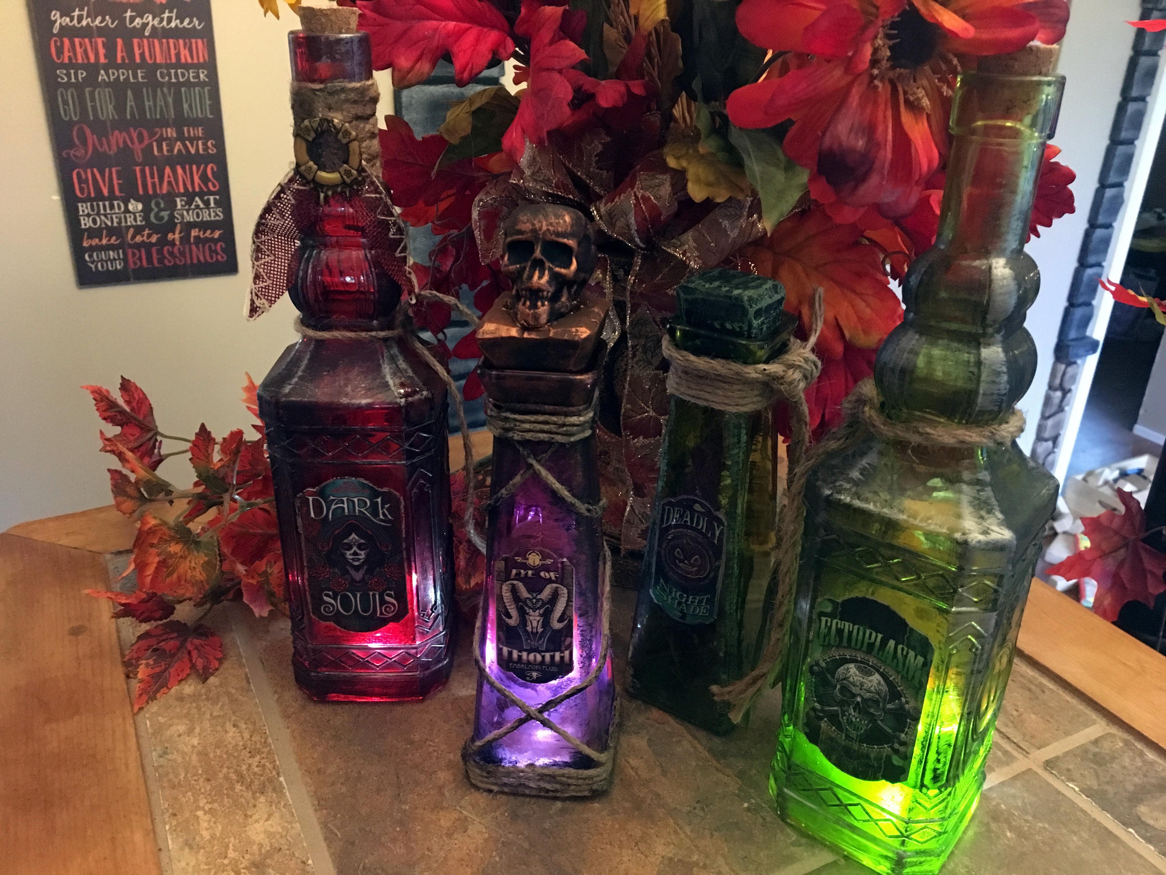 A bunch of Dollar Store bottles upgraded into epic Halloween props. r