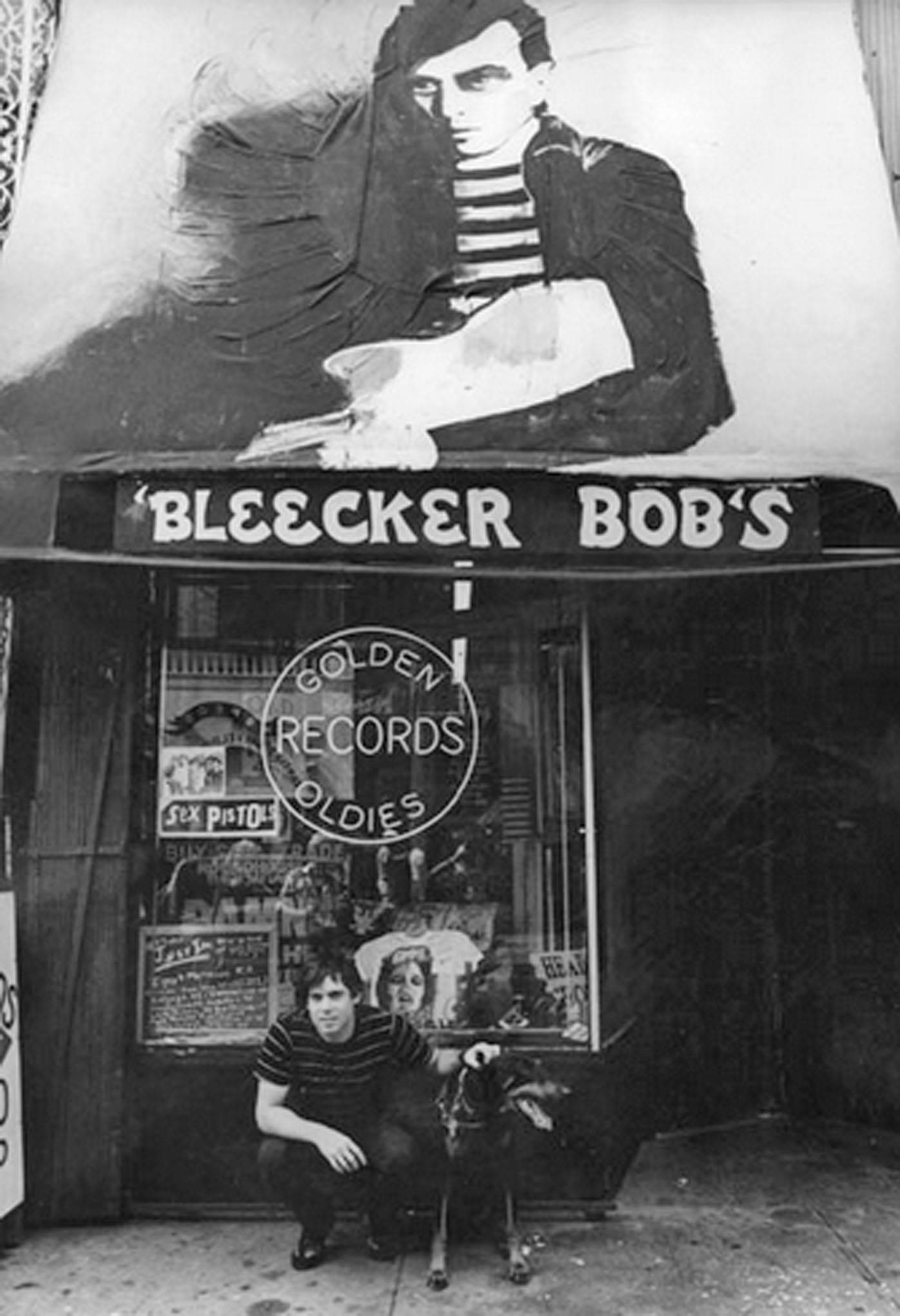 Bleecker Bob Beneath His Original Store’s Unfinished Awning Mural, MacDougal Street, NYC, 1977