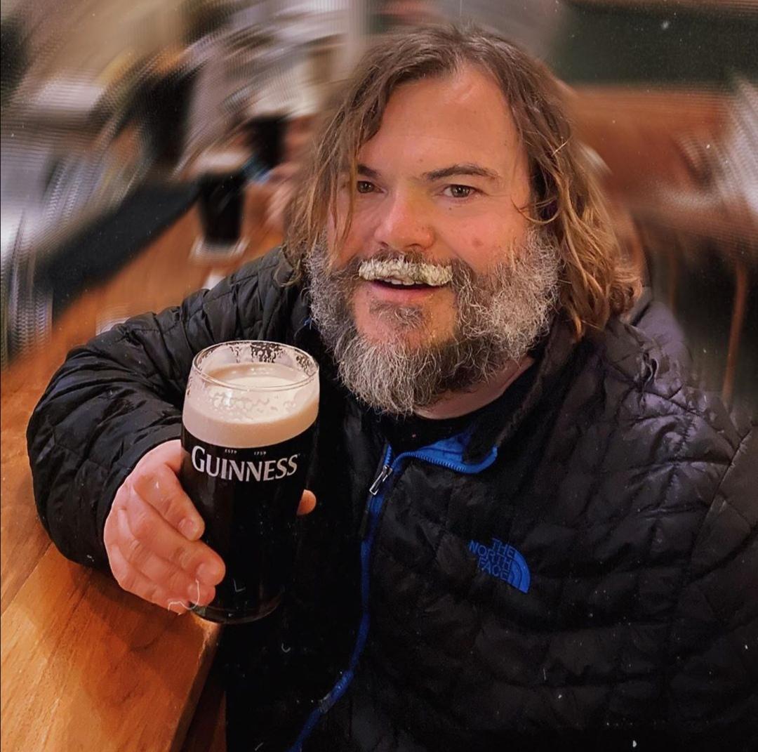 PsBattle Jack Black drinking a pint of Guinness.