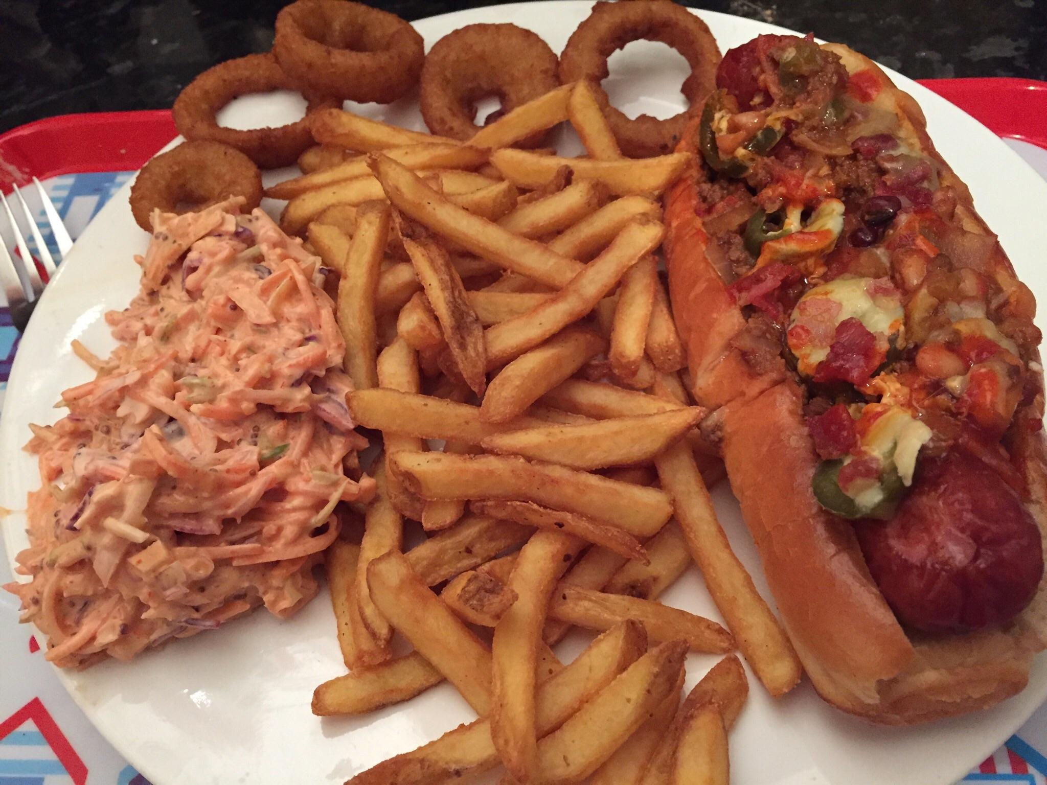 Onion rings, habanero slaw, fries and hot dog topped with chilli beef