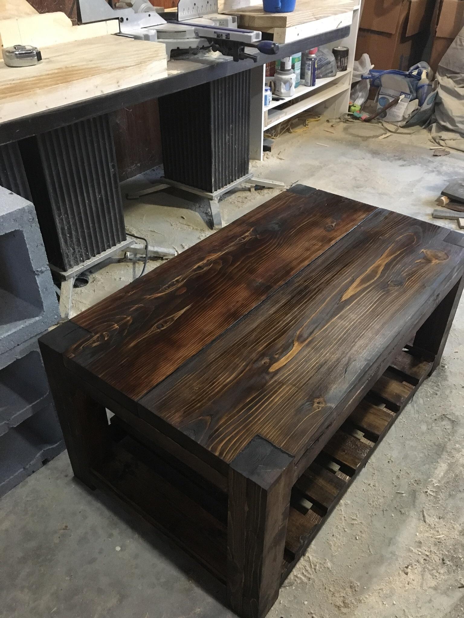I built a coffee table out of scrap wood from a job site. (Album in