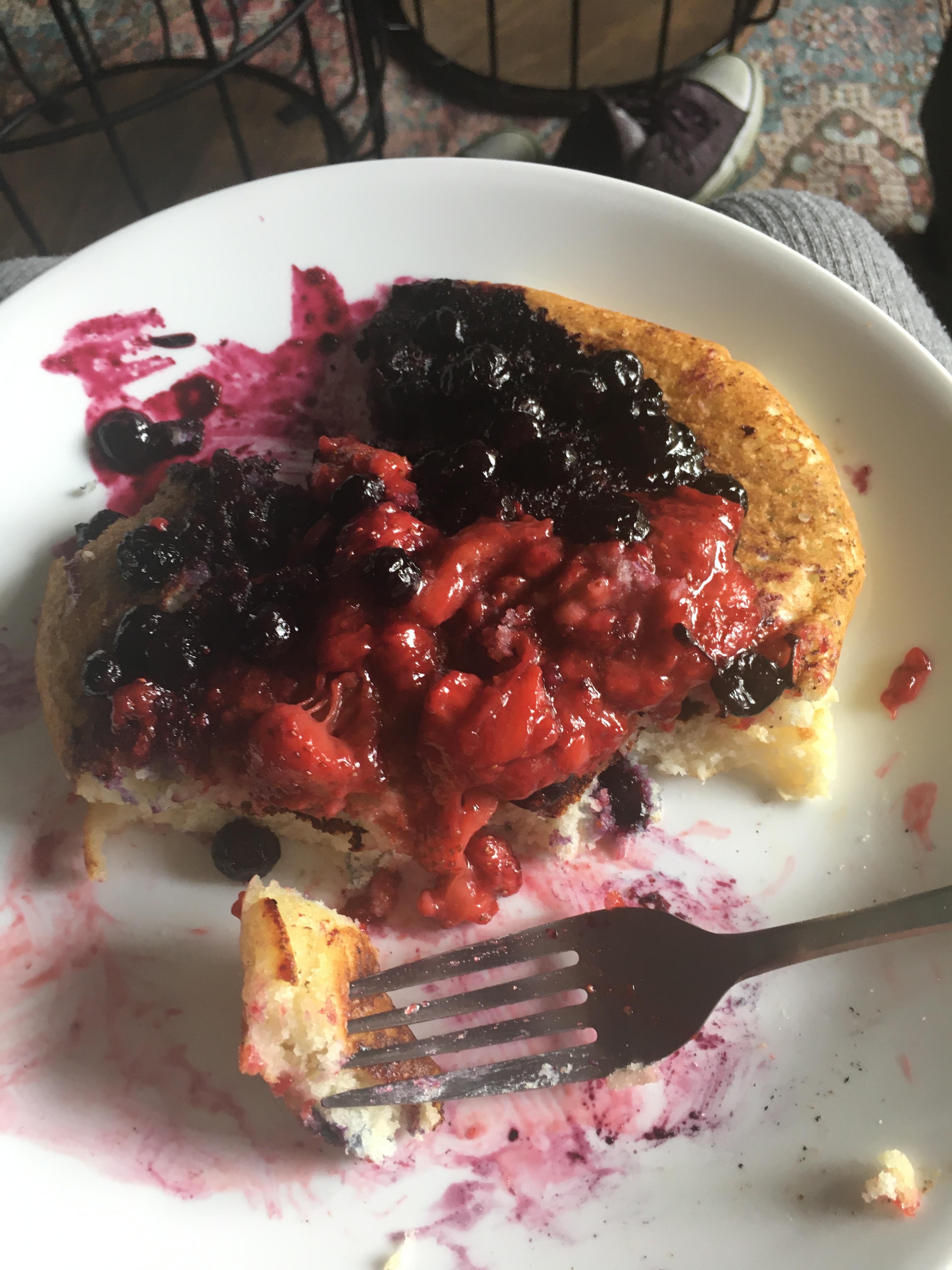 Pancakes with homemade blueberry compote and strawberry topping.. r