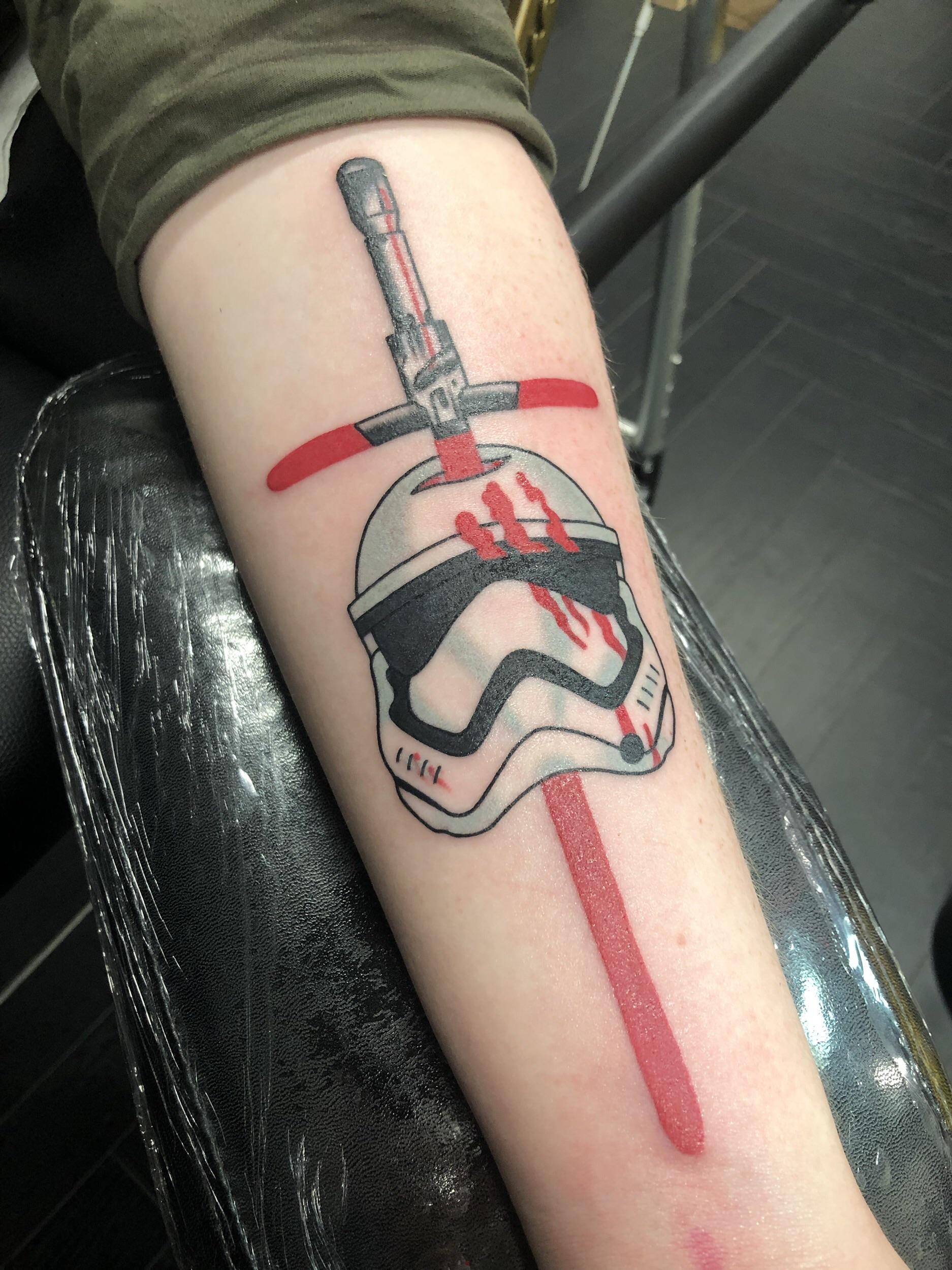 My second tattoo, kylo ren sabre cutting through fins stormtrooper
