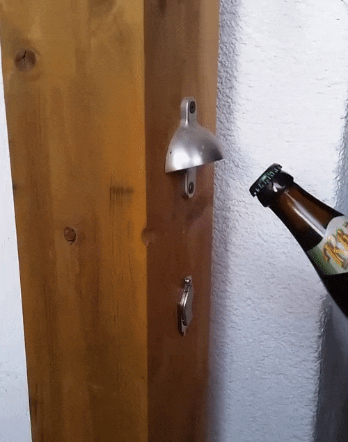 My dad built a simple stationary bottle opener that catches the cap gifs