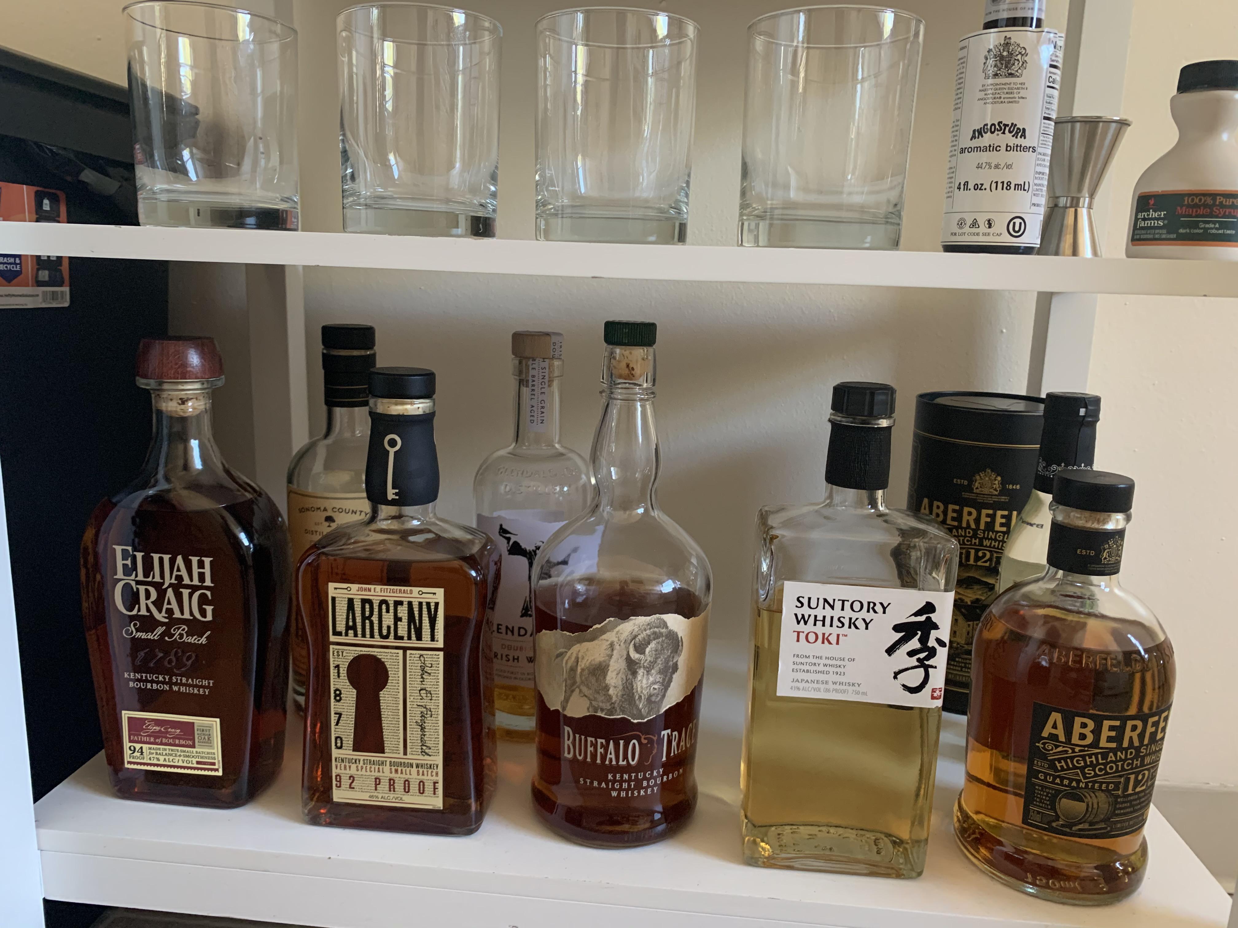 New Apartment’s small bar cart whiskey