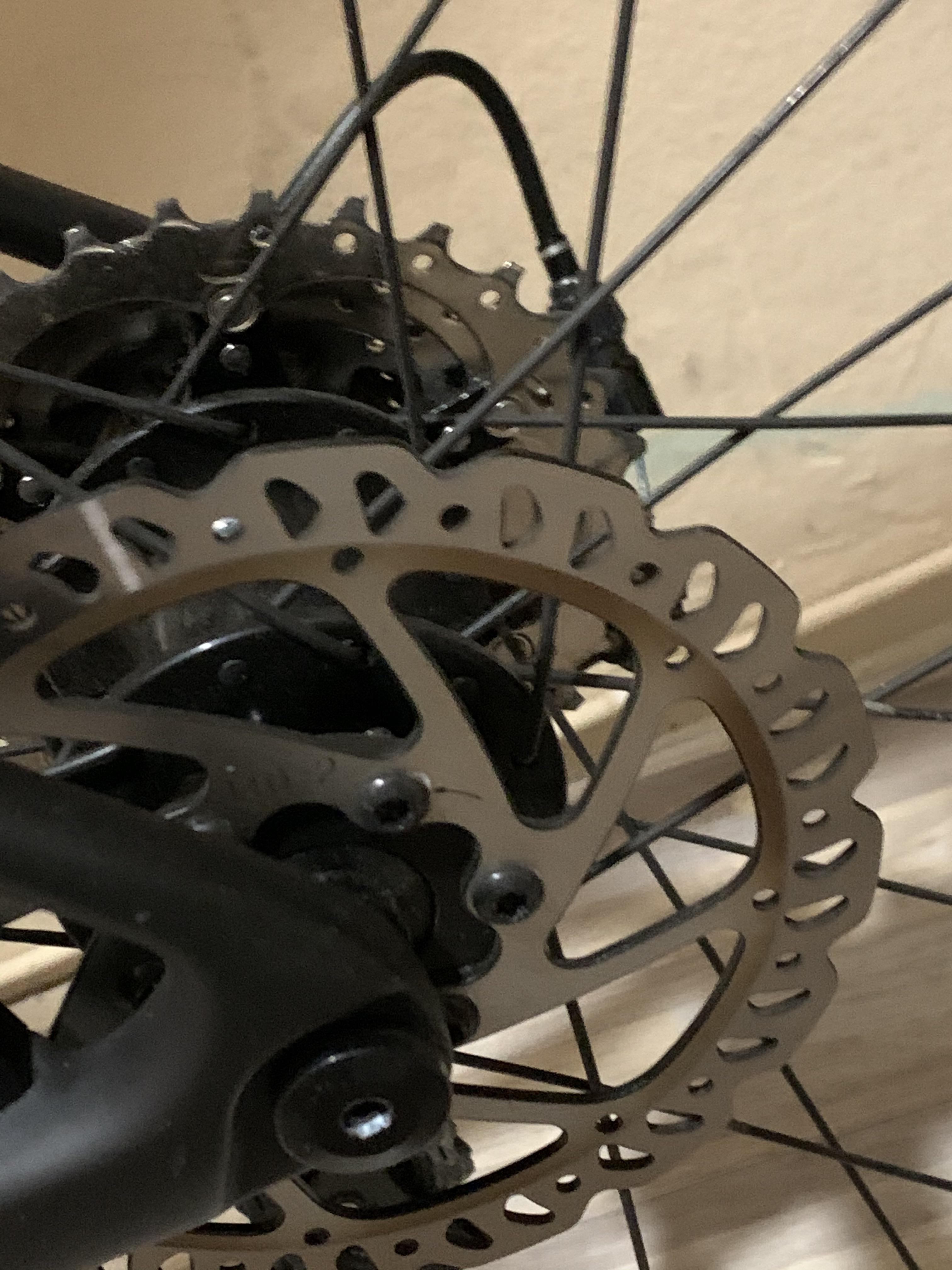 Does anybody know how I can clean this on my disc brakes? r/bicycling