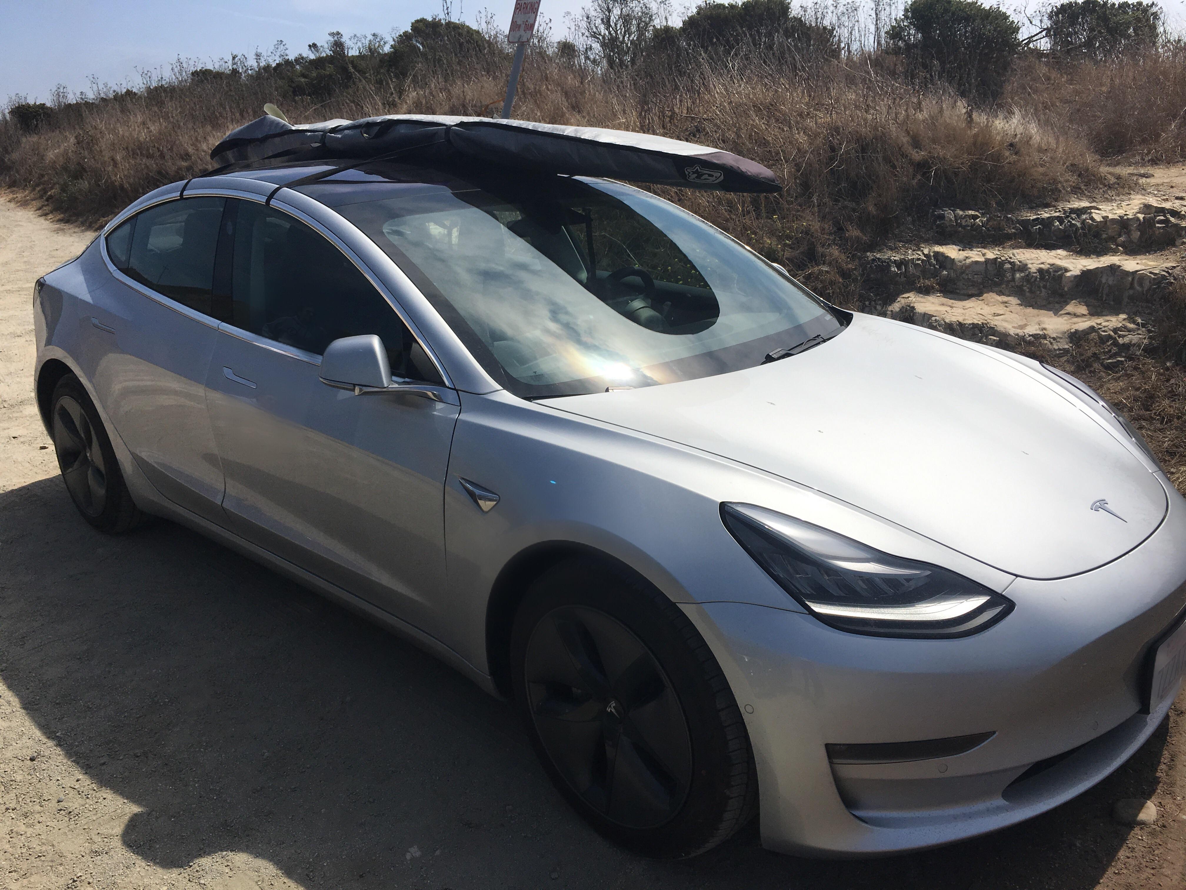 Tesla Model 3 with Surf Board | Rebrn.com