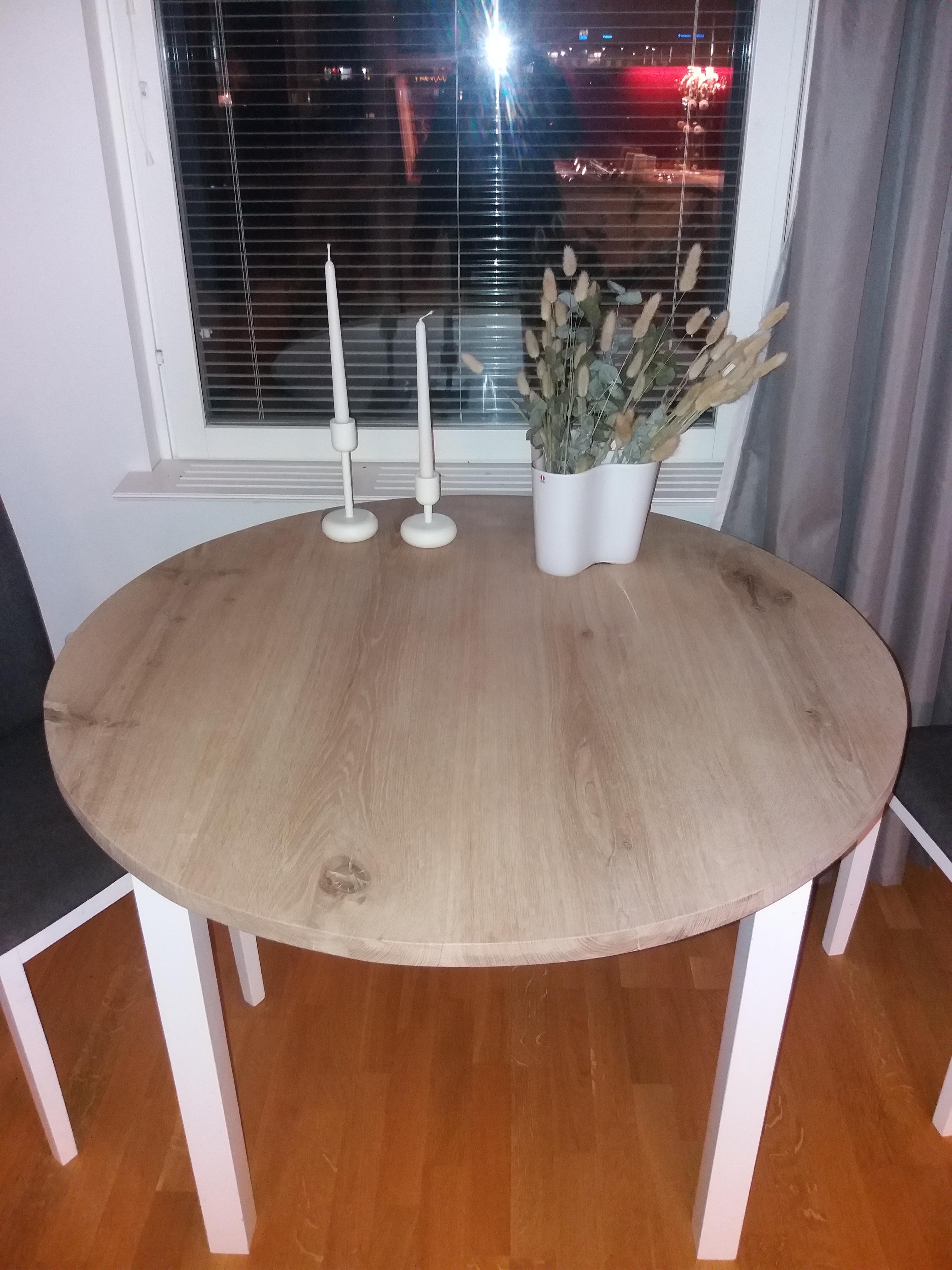 Round oak tabletop on some Ikea legs. Im gonna make beautifuller legs