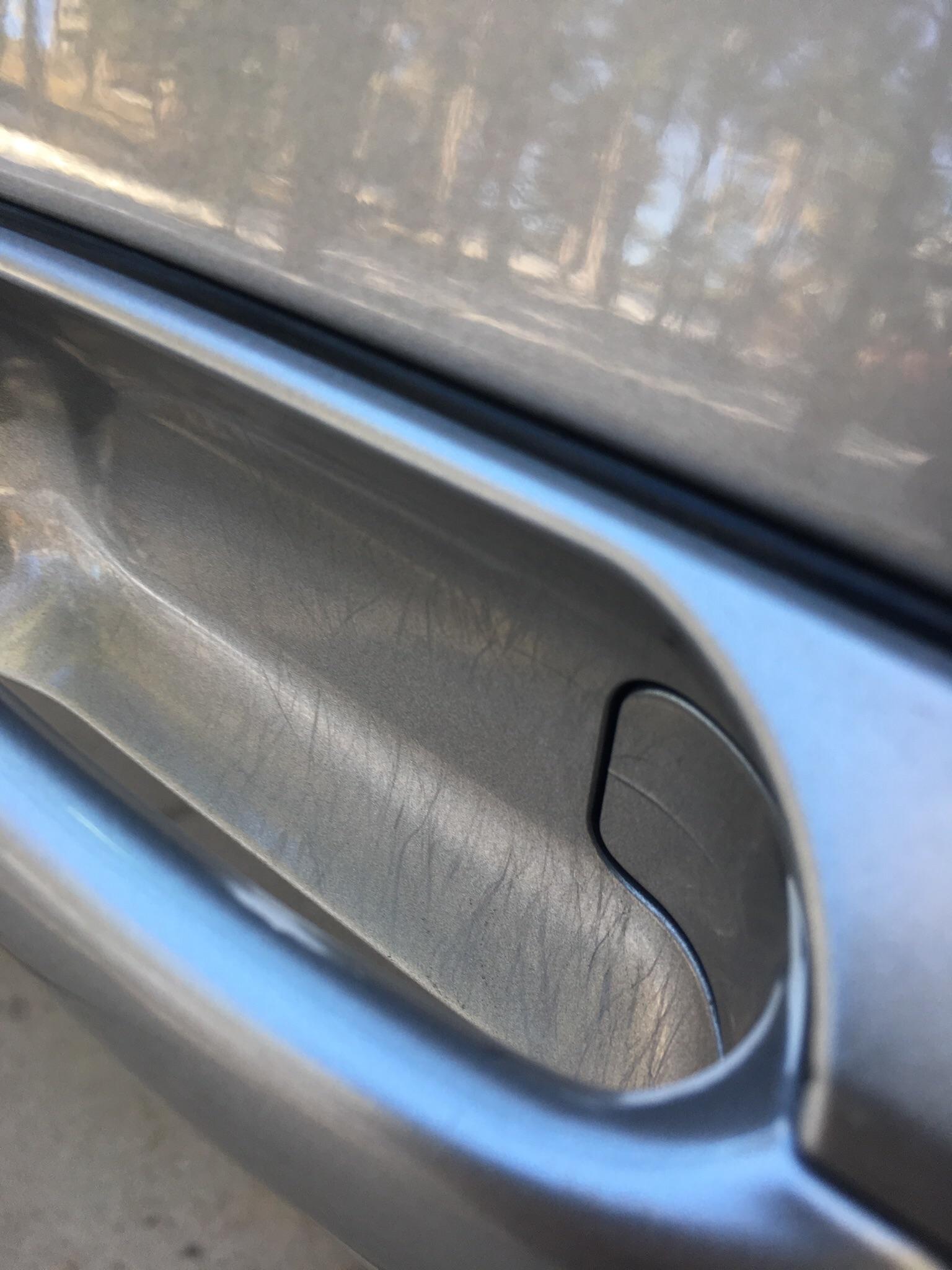 These scratches under my car’s door handle from the previous owner’s