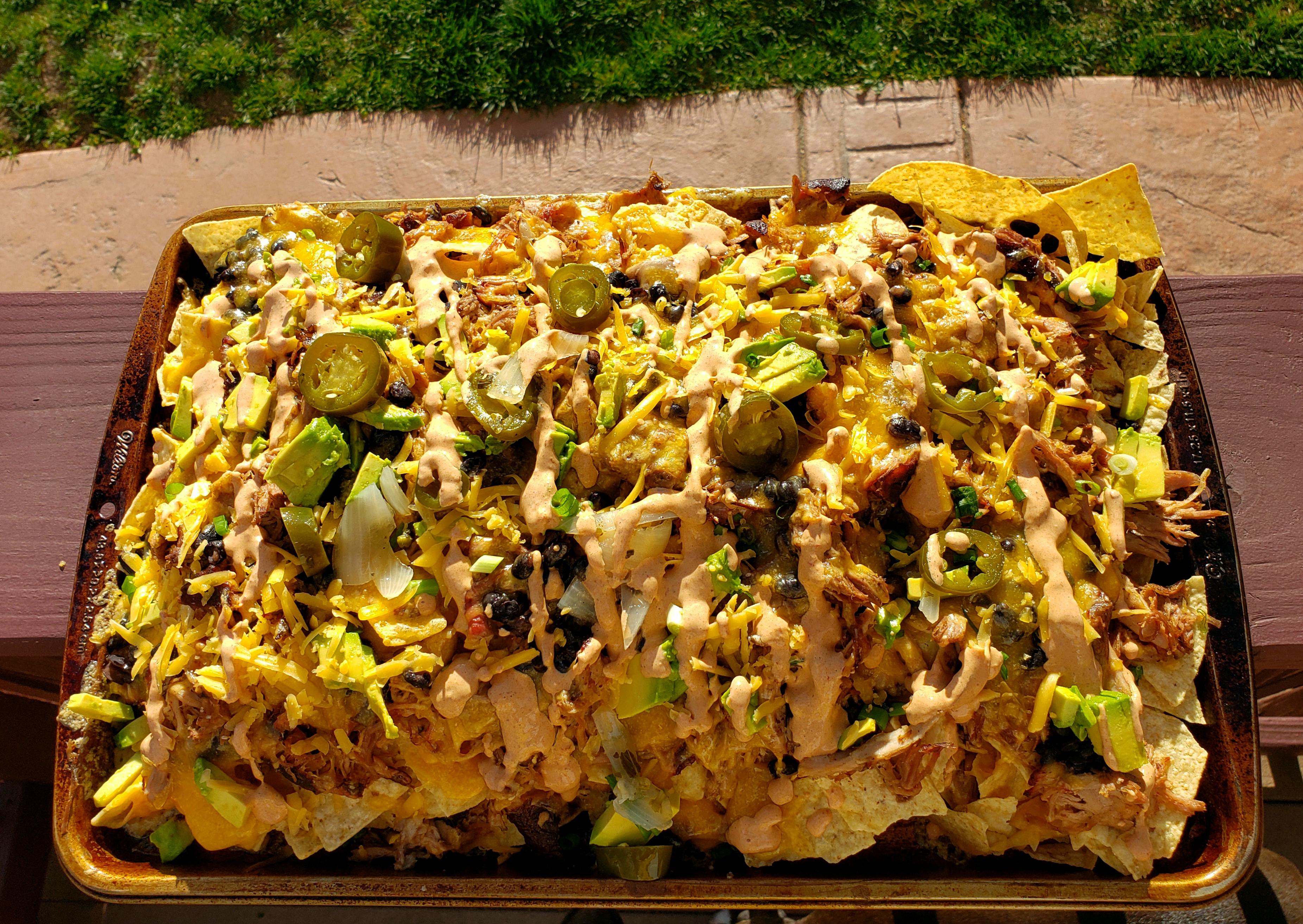 My first pork shoulder turned into nachos. Peach smoked shoulder, with