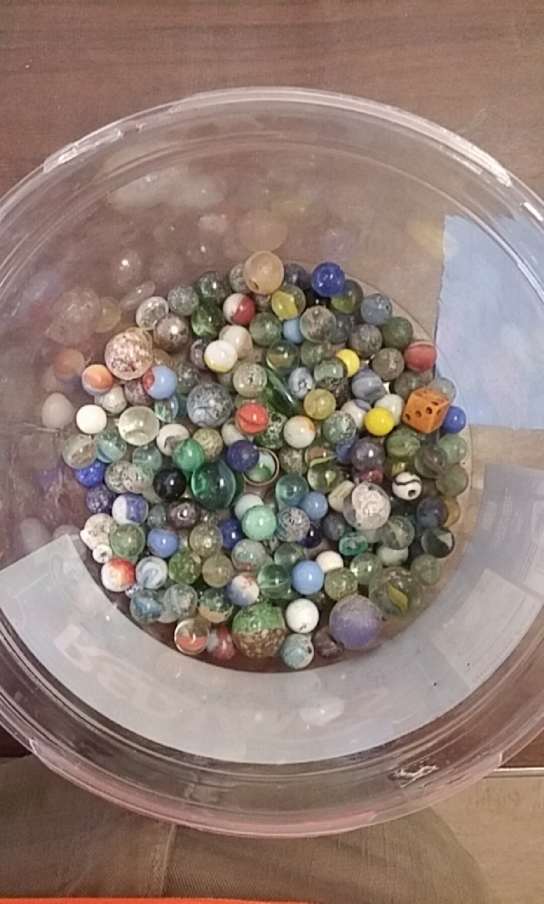 My company is remodeling duplexs from the 50s. I find marbles everyday