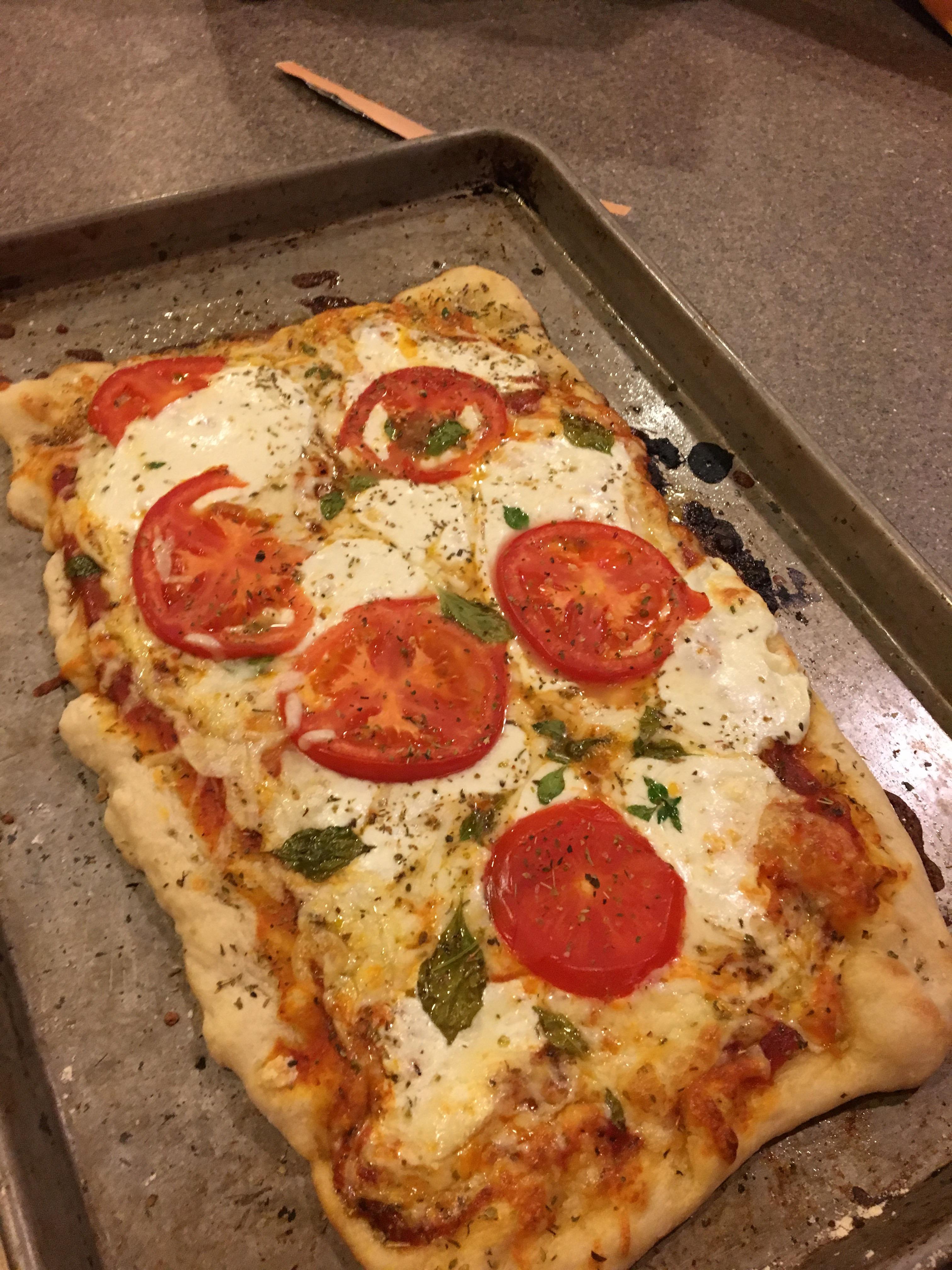 [homemade] Beautiful margarita pizza with homegrown basil as a final touch! r/food