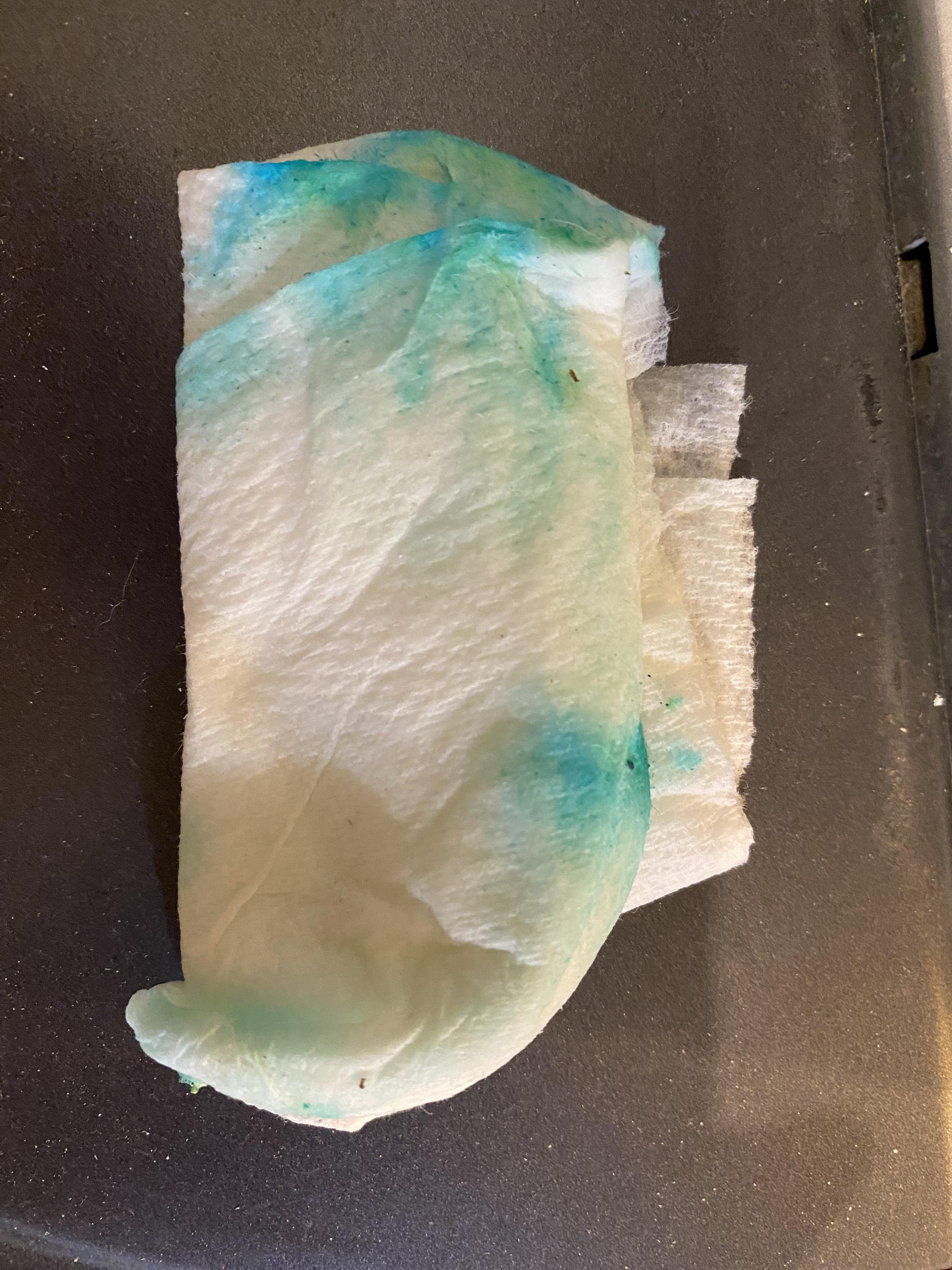 Invisible fine powder turns to blue green liquid when wet it’s all