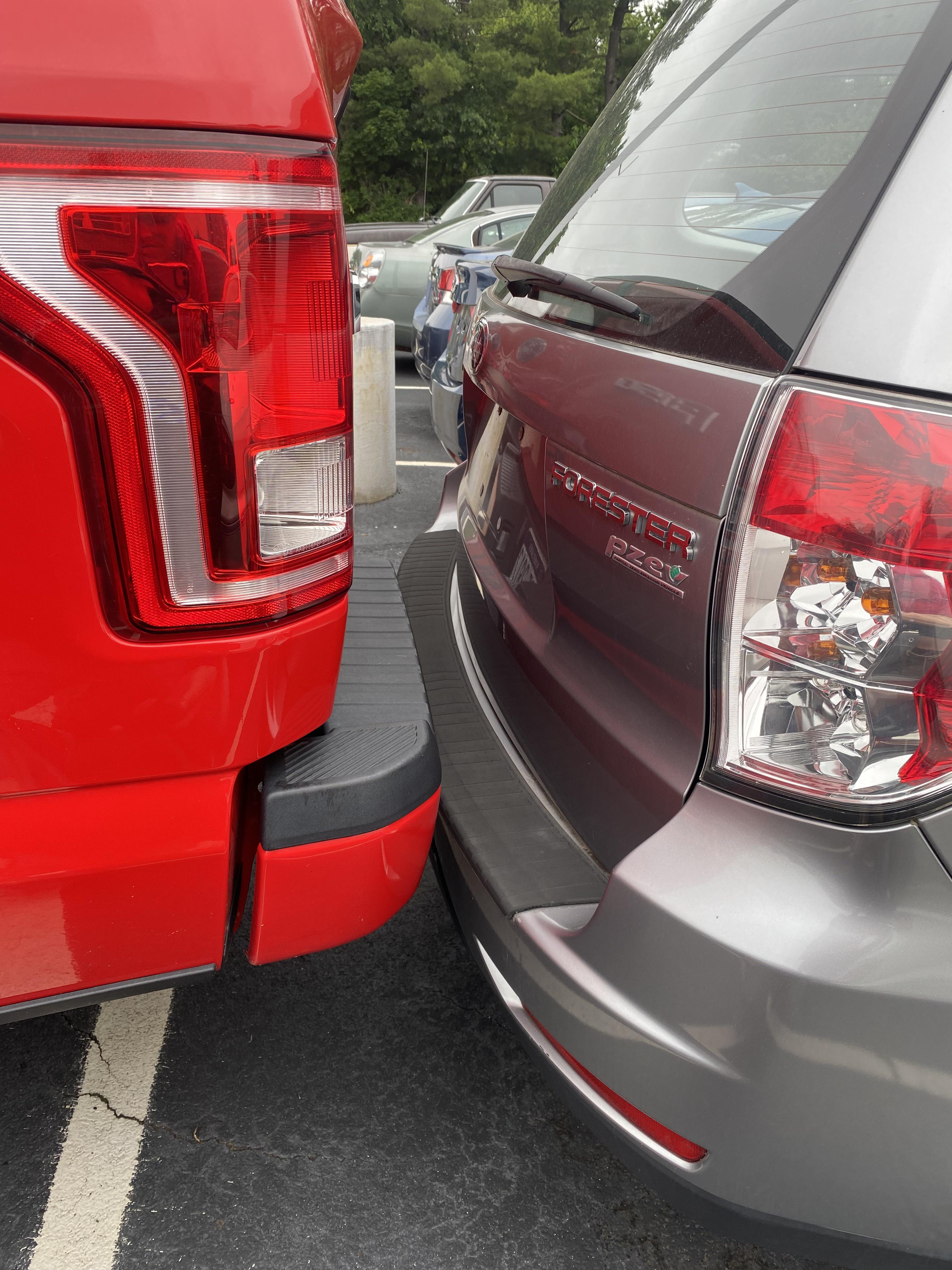 The grumpy service writer that no one likes backed into a customer car