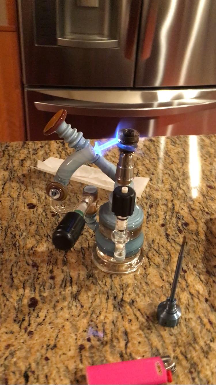 Haha down the coolest dab rig I've ever seen. Equipped with a built in