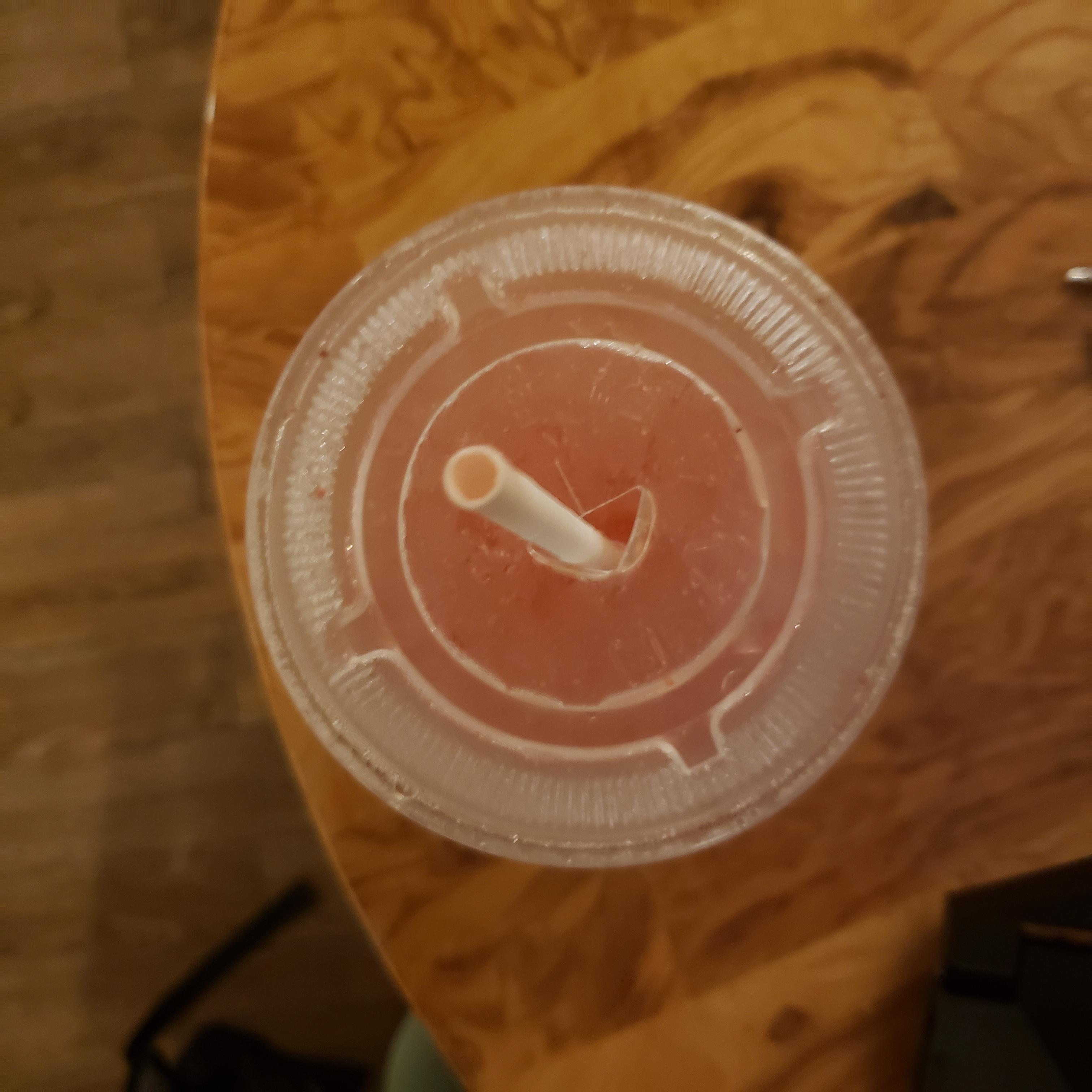 If you're using a paper straw, bend one or two of the straw holders on