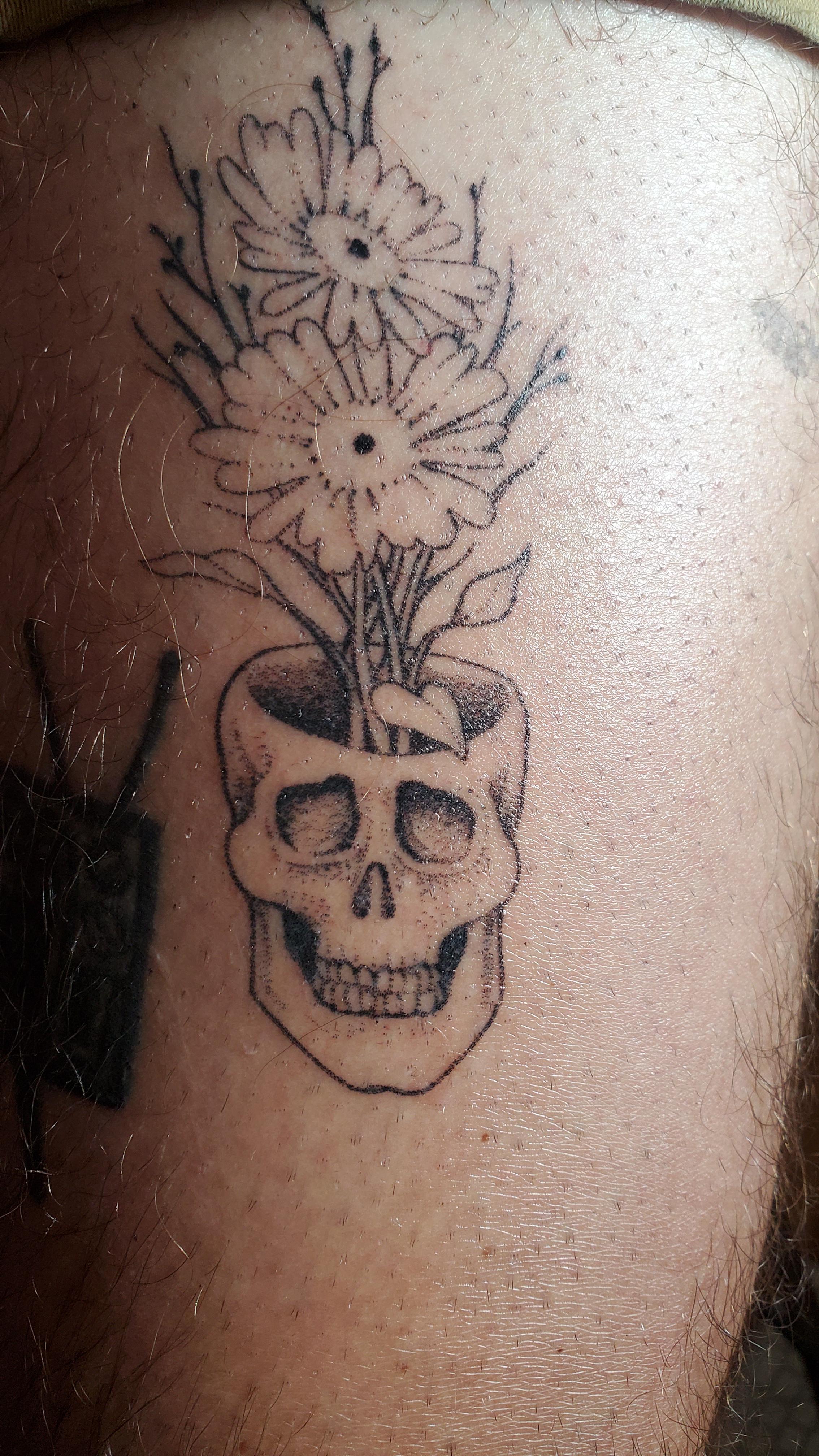 Flowers Growing Out of a Skull by Rachel Paton at Ritual Tattoo
