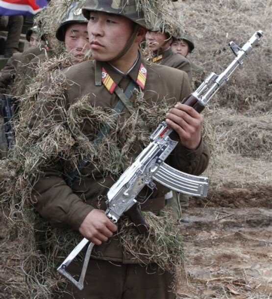 North korean soldier carrying a silverplated AK47. r/SocialistRA