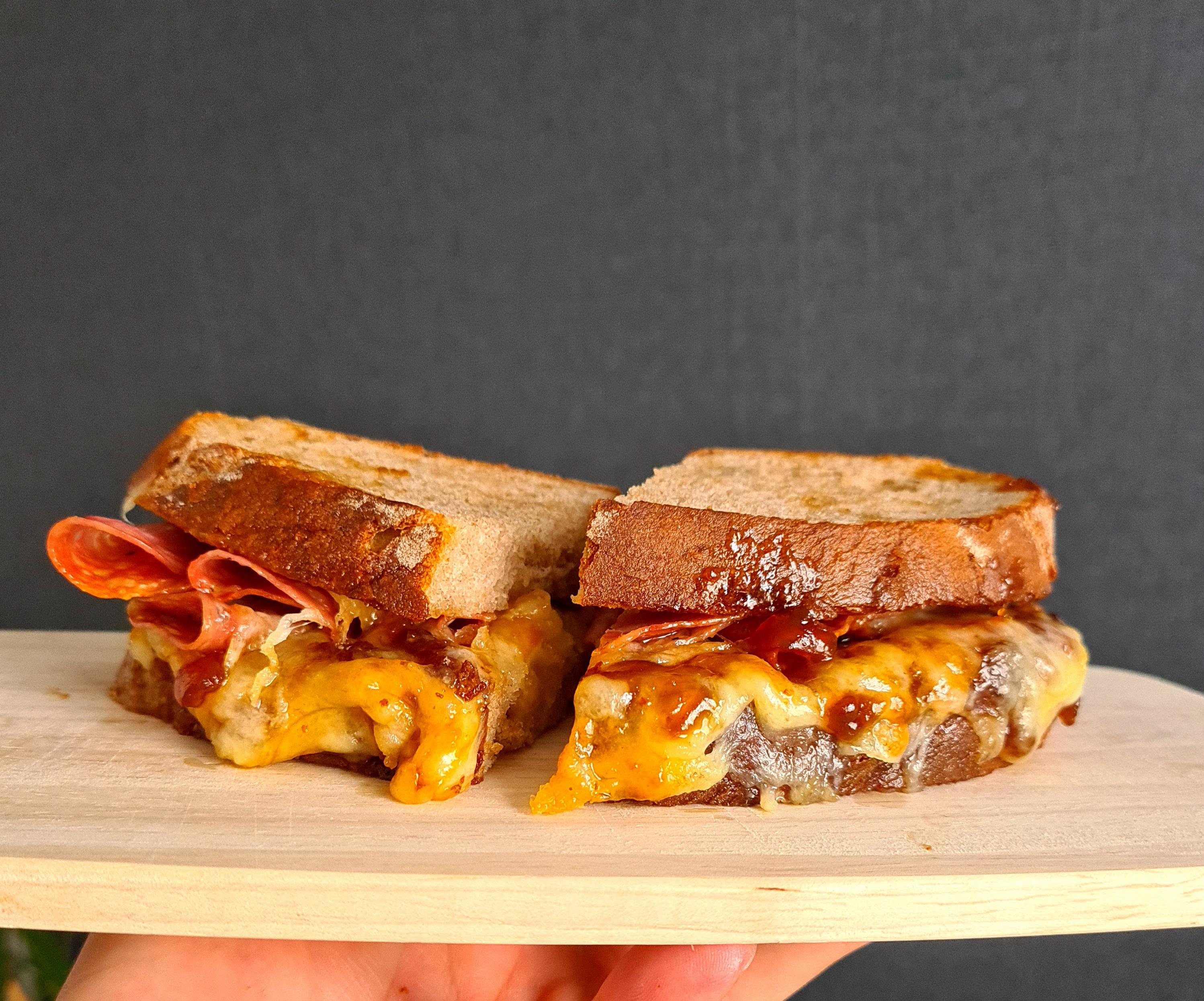 Emmental/cheddar melt with salami and caramelised red onion chutney on