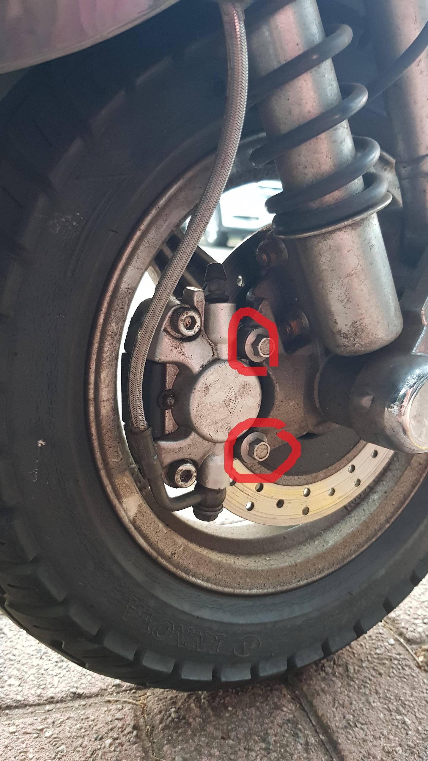 Can't get front brake caliper off after removing highlighted bolts