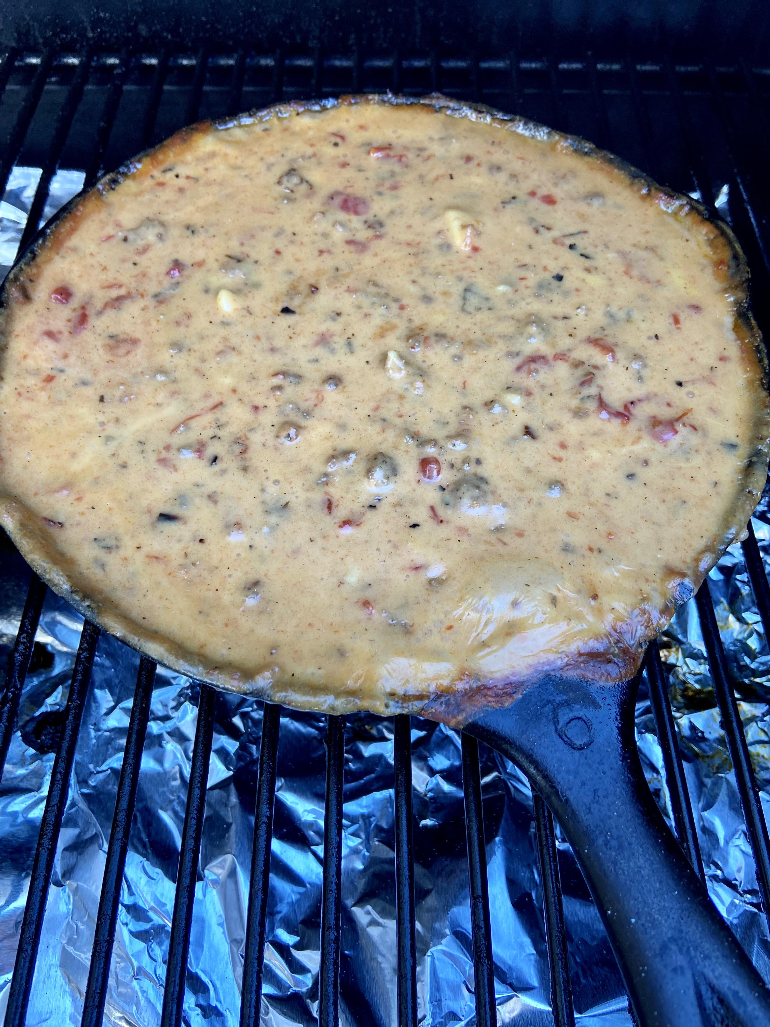 Spicy queso with fire roasted tomatoes, green chilies, and breakfast