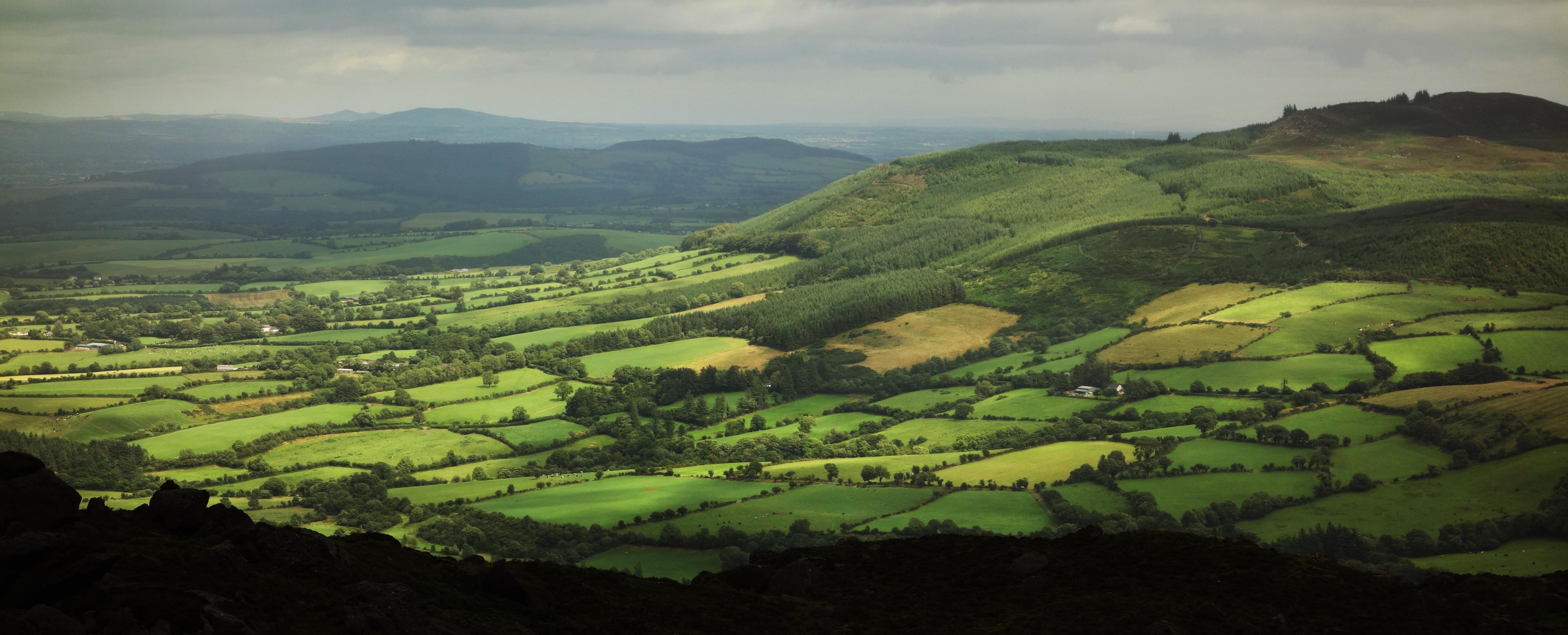 Sun and shade over the green hills of Ireland. Near Comeragh Mountains