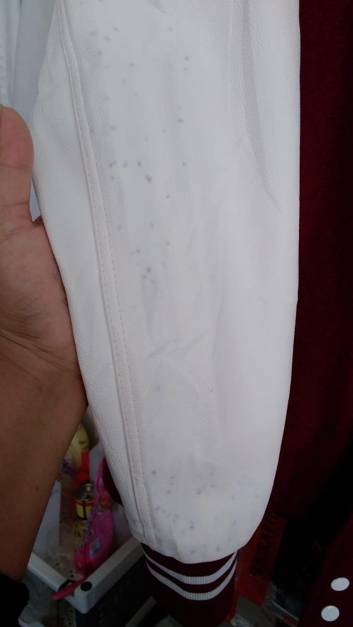 How to clean this ink stain on my varsity jacket? should i use leather